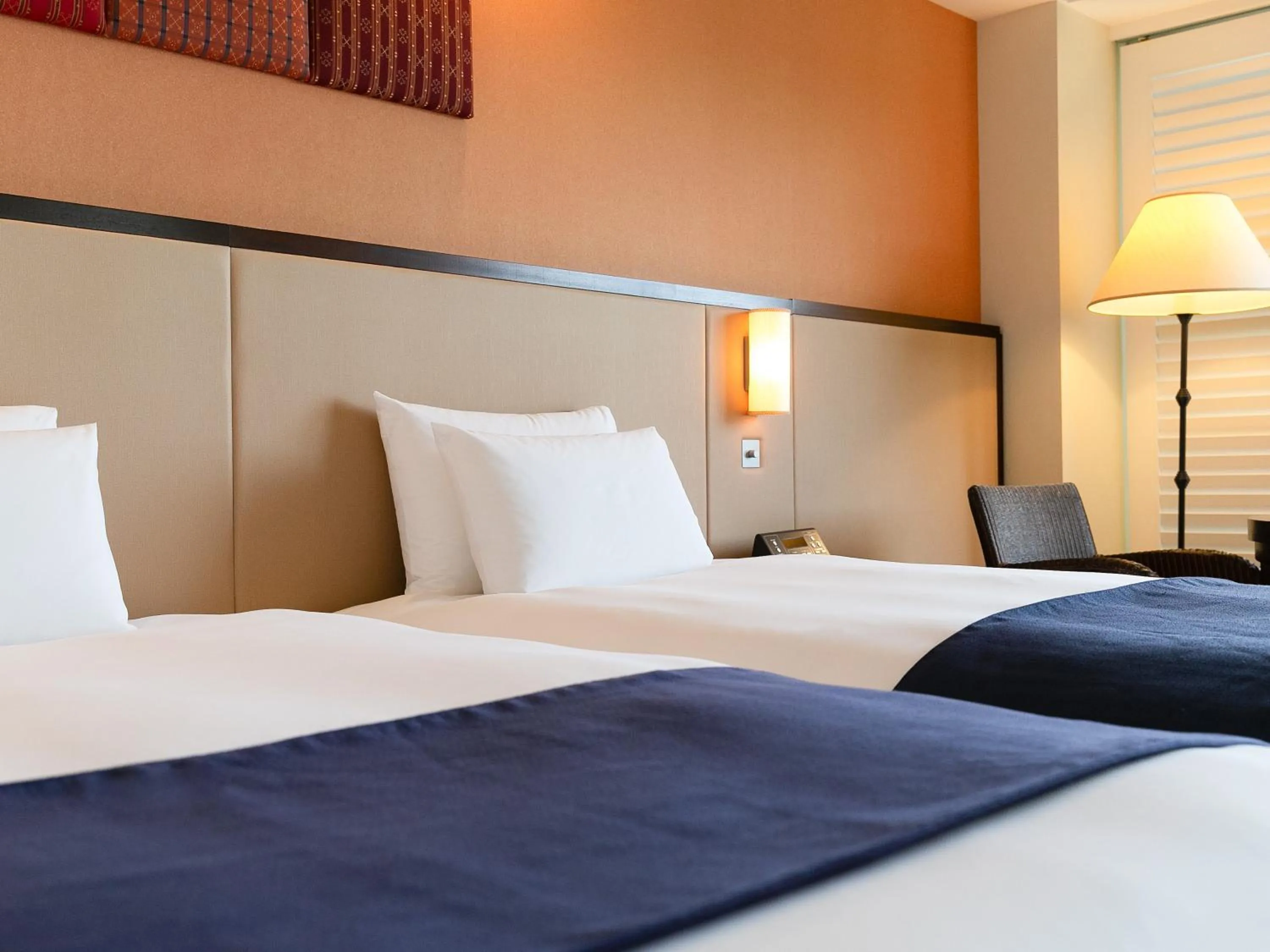 Bed in Hotel Nikko Alivila