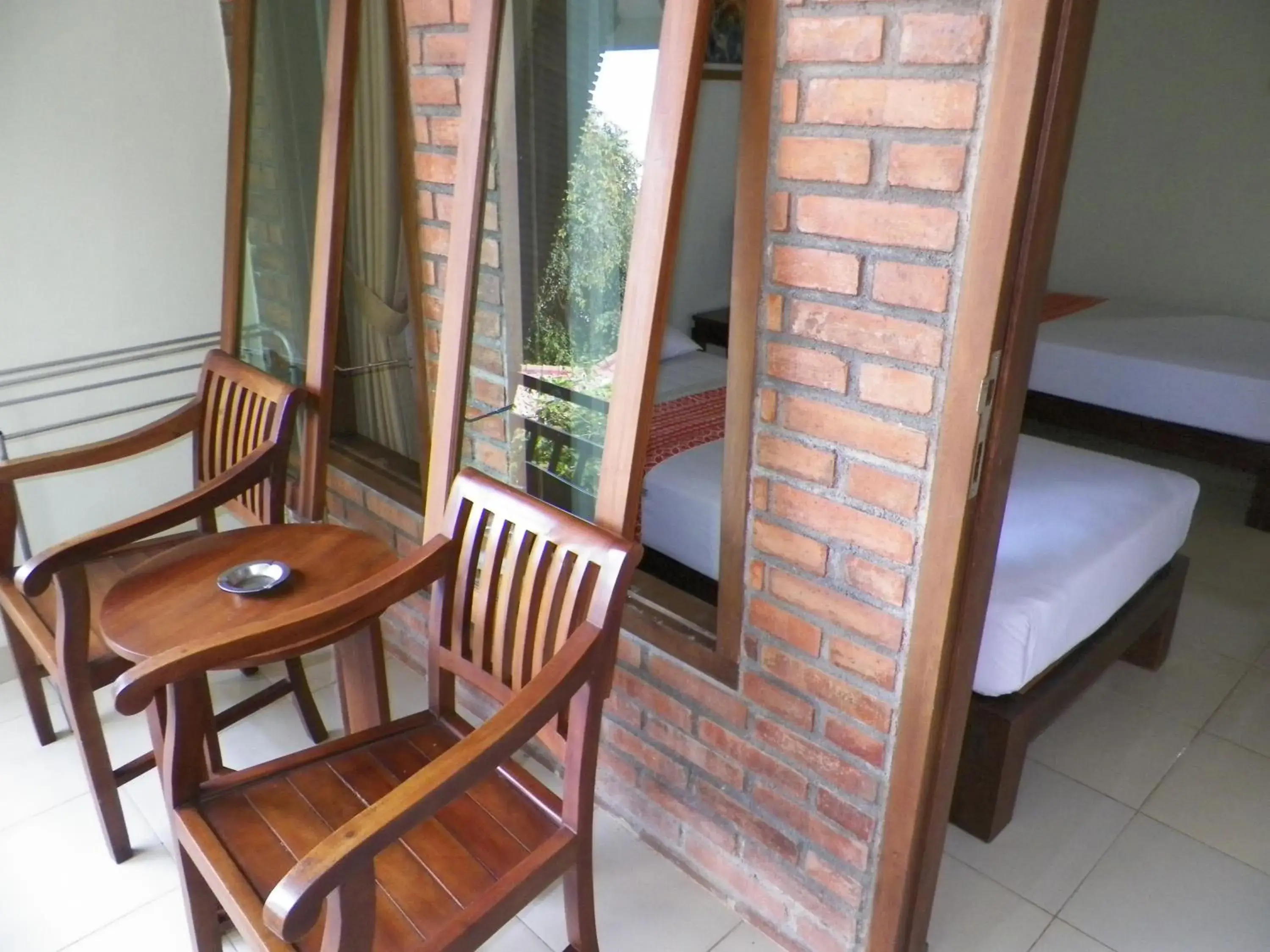 Balcony/Terrace, Bed in Puri Pangeran Hotel Balcony/Terrace, Bed in Puri Pangeran Hotel