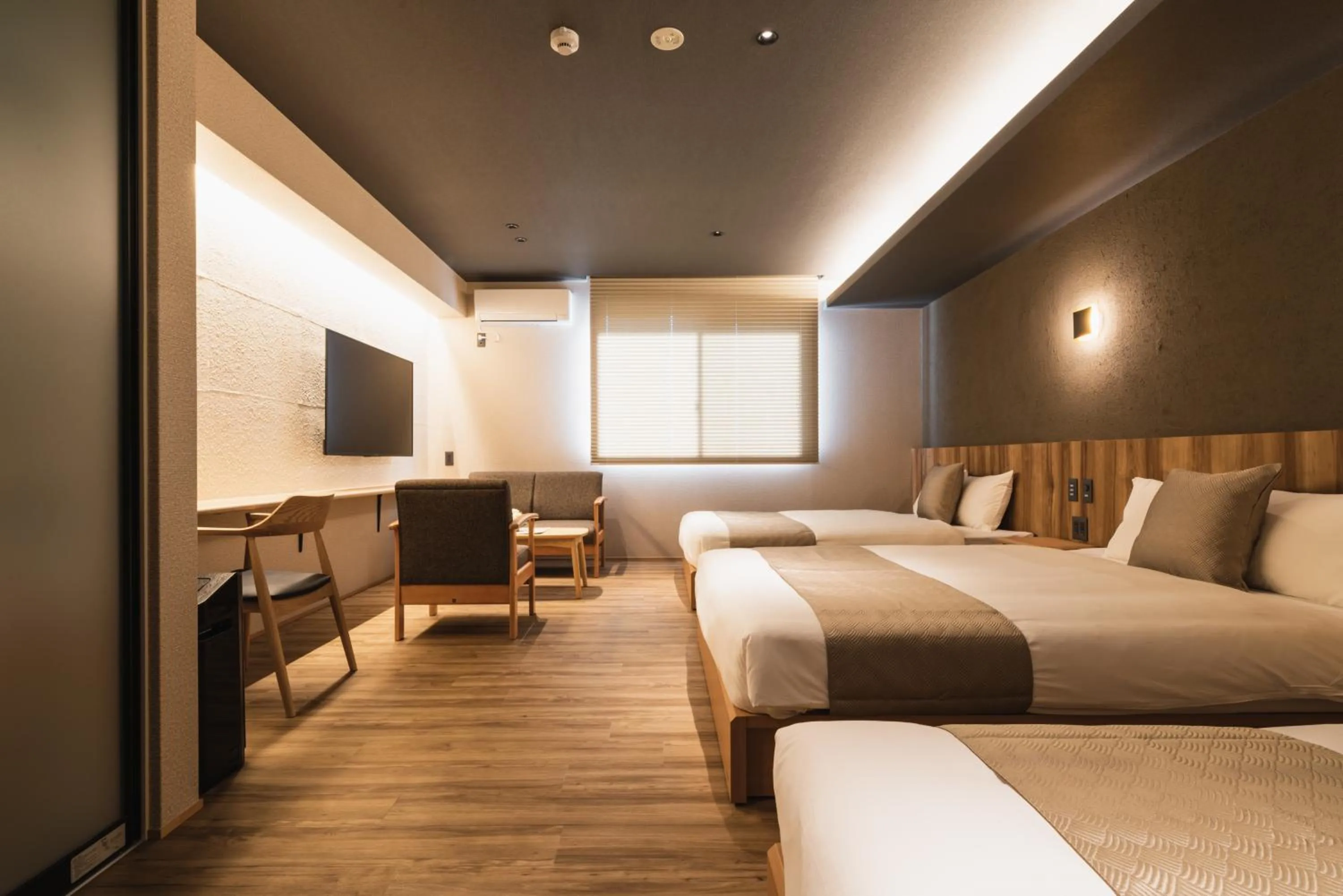 Photo of the whole room, Bed in GRAND BASE Beppu Ekihigashi