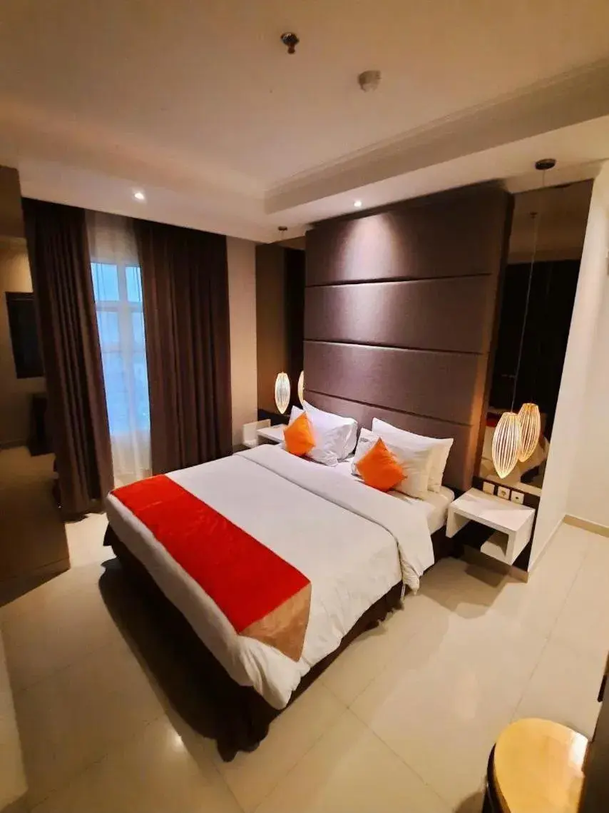 Bed in The Bellezza Suites