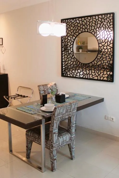 Dining area in The Bellezza Suites by Nemuru