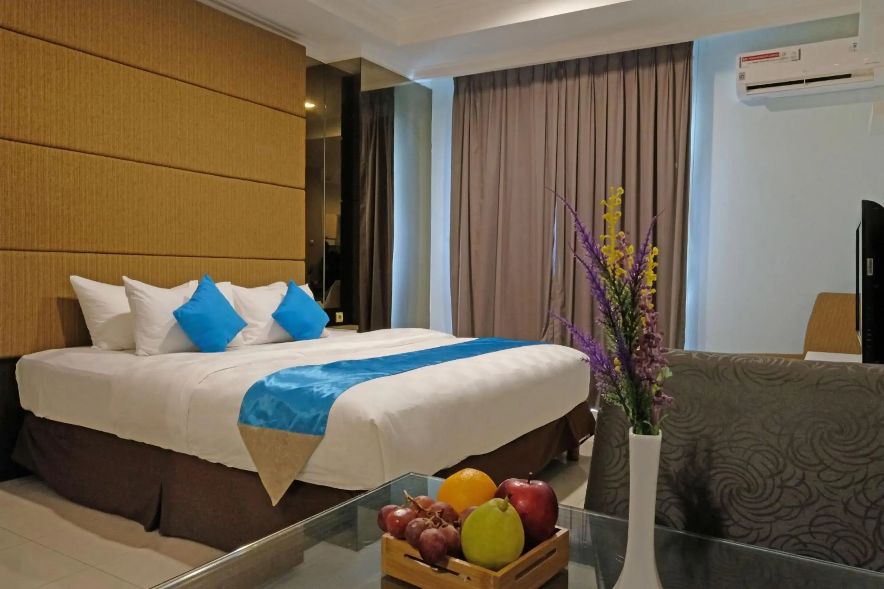 Bed in The Bellezza Suites