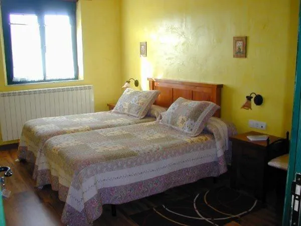 Bed in Hostería Casa Flor