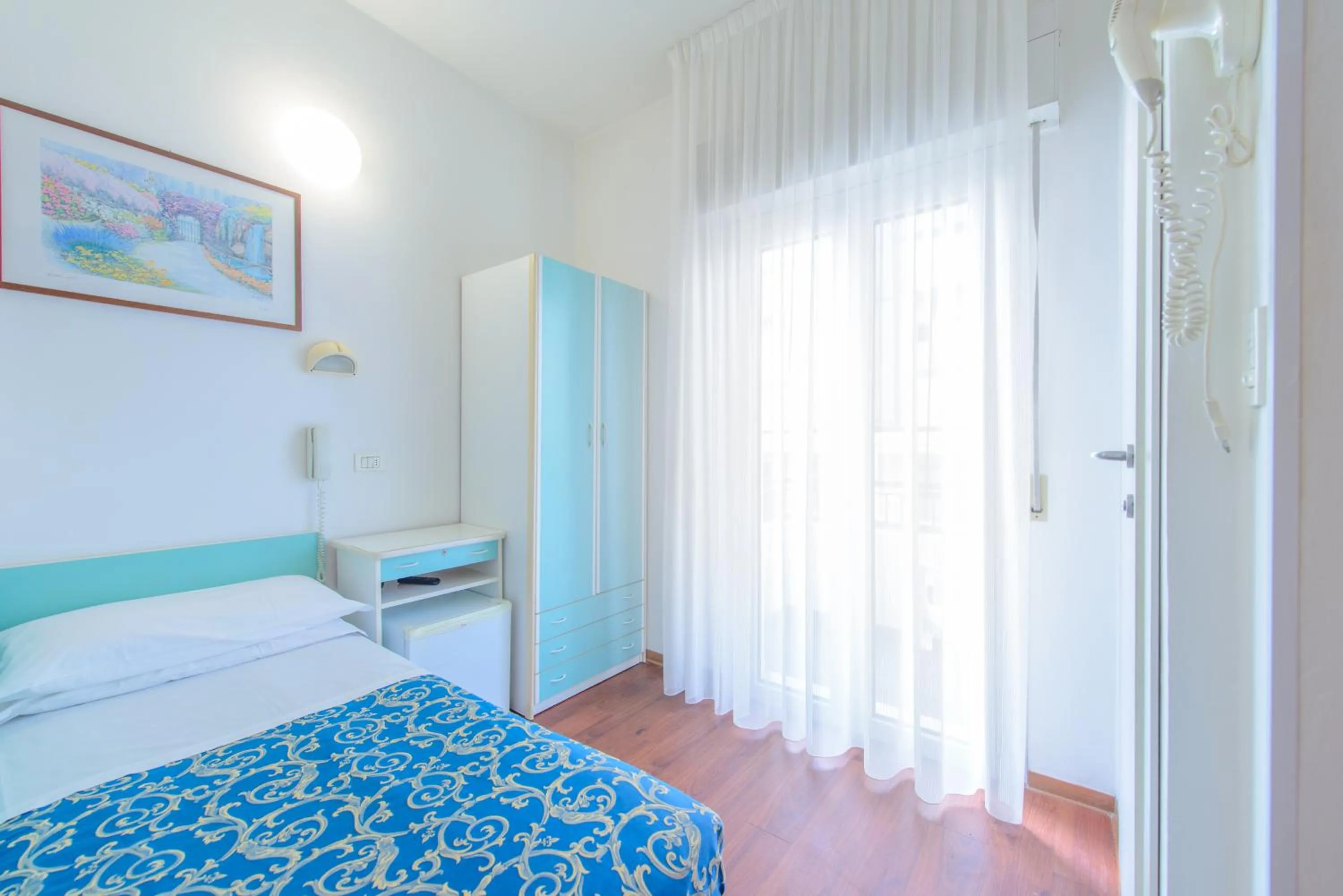 Bed in Hotel San Marino