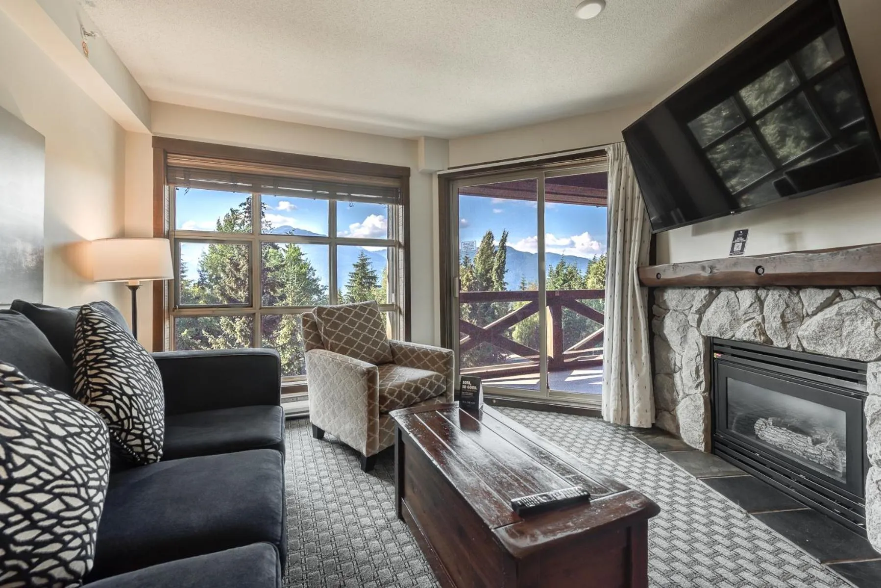 TV and multimedia in Blackcomb Springs Suites by CLIQUE