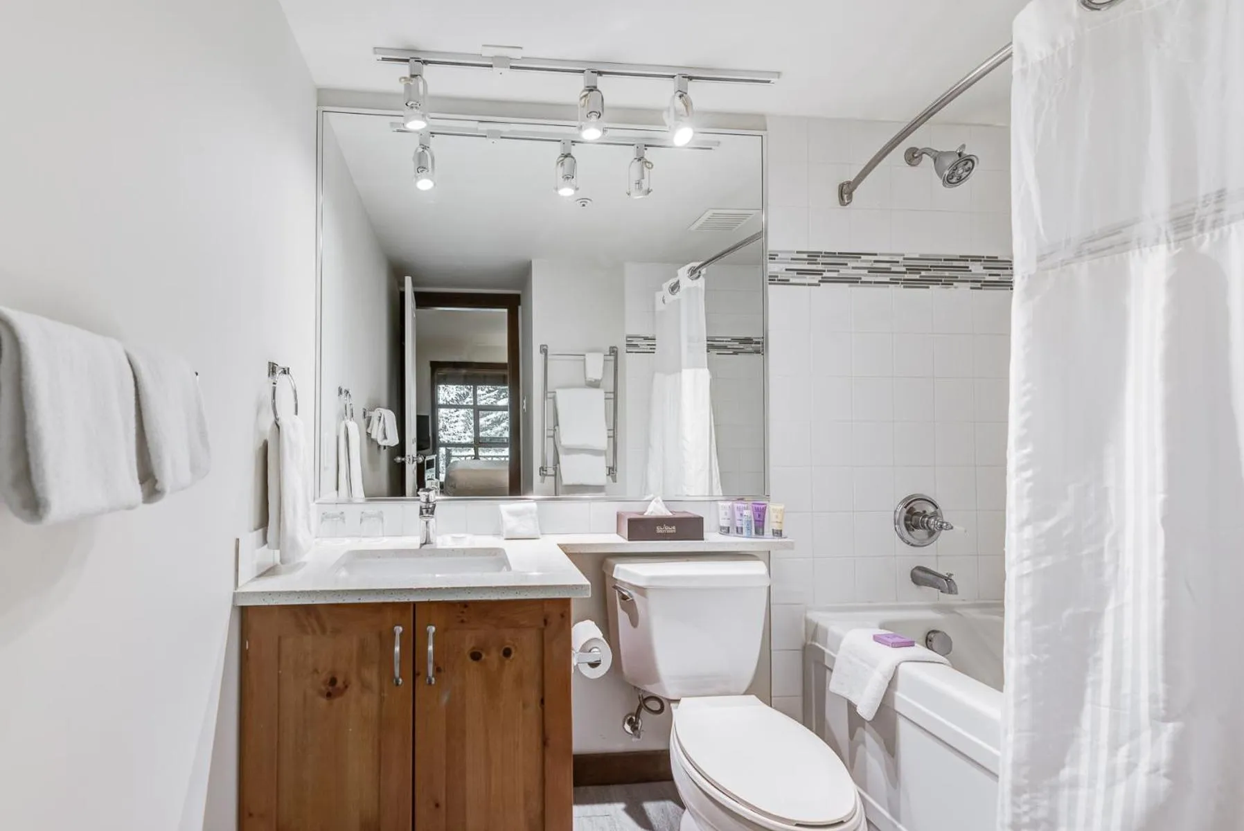 Shower in Blackcomb Springs Suites by CLIQUE