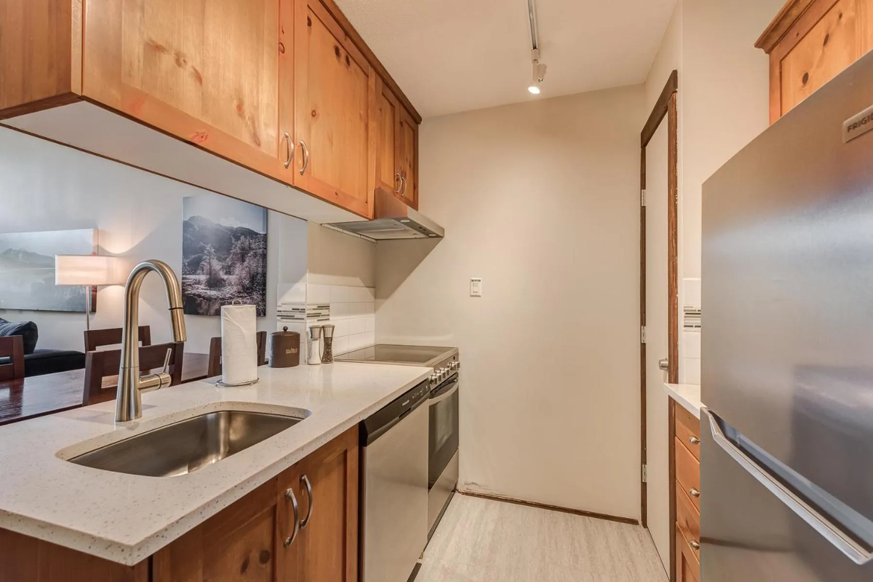 Kitchen or kitchenette in Blackcomb Springs Suites by CLIQUE