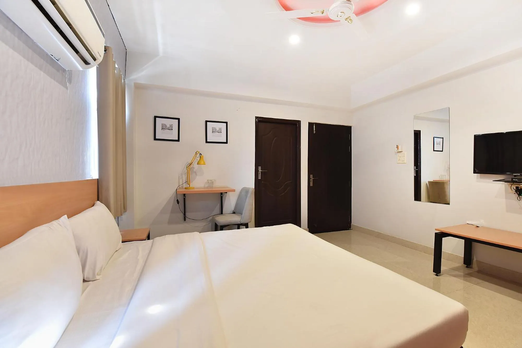 Bed in FabHotel Rushank Palace