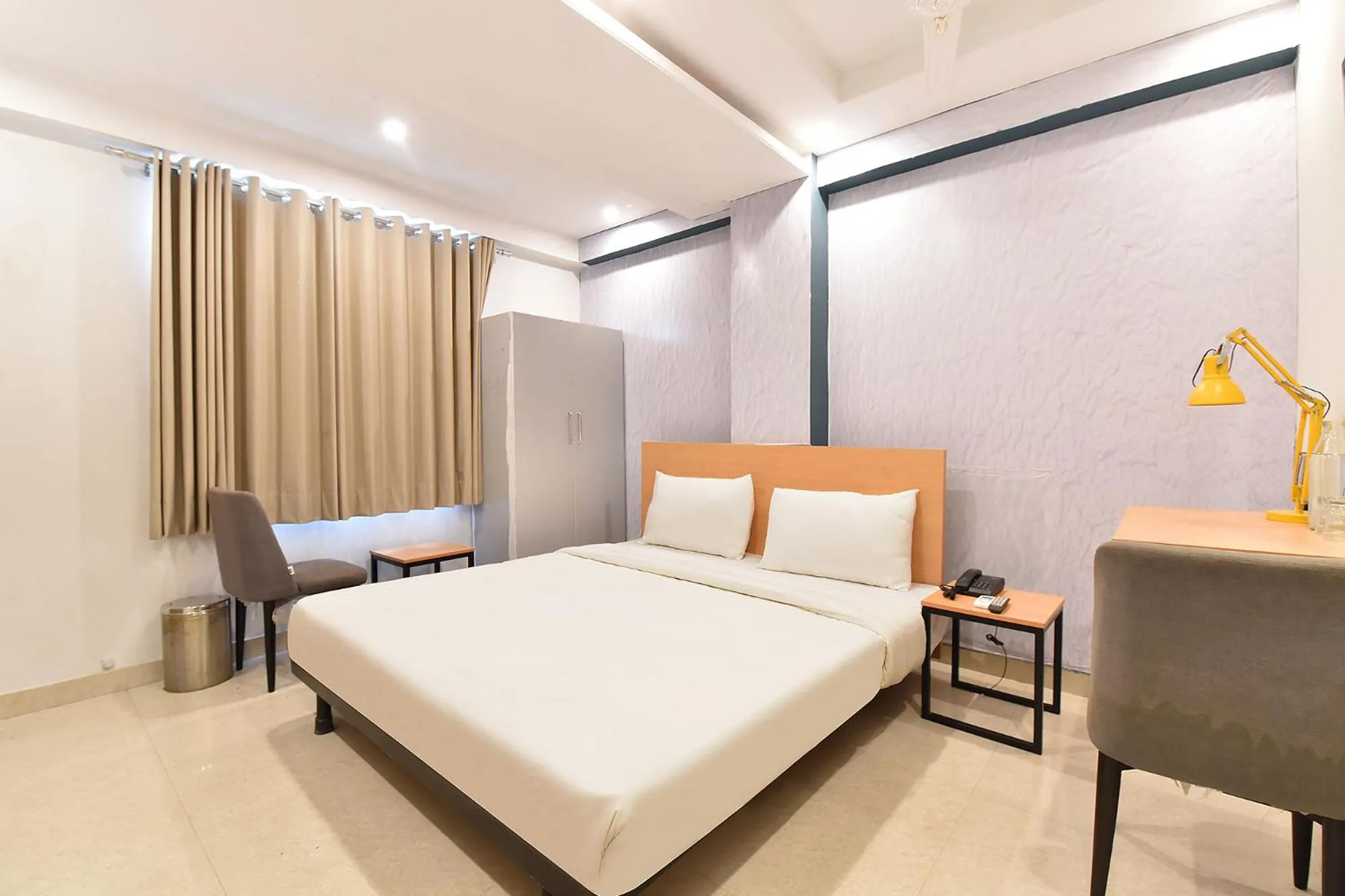 Bed in FabHotel Rushank Palace