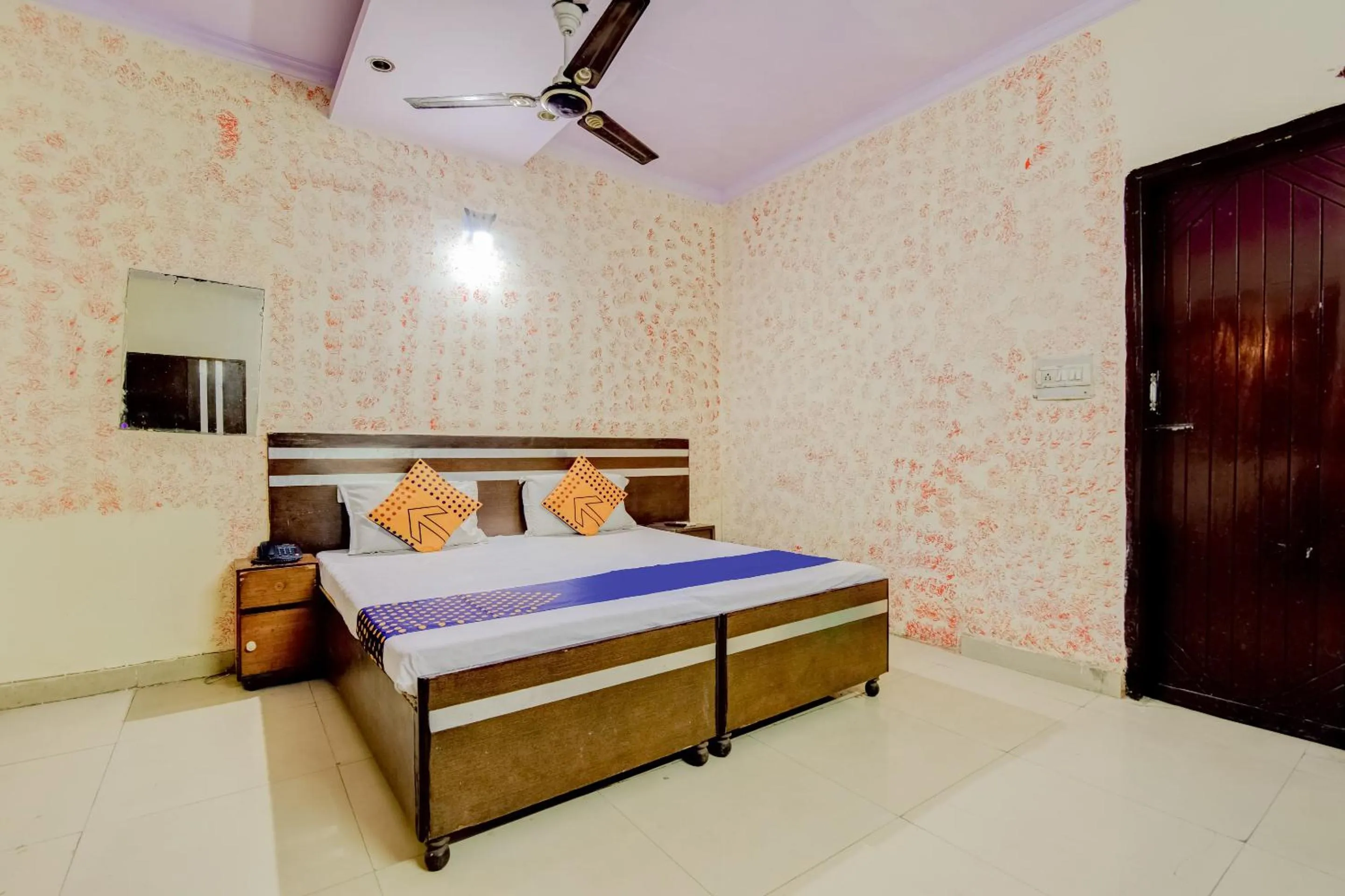 Bedroom, Bed in Spot On Swagat Palace