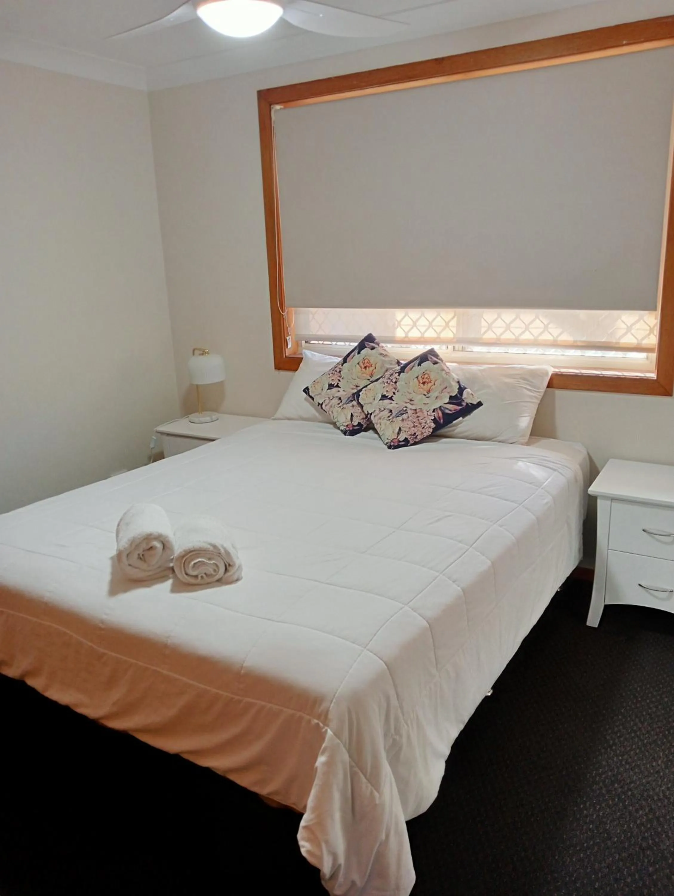 Bed in Forster Palms Motel