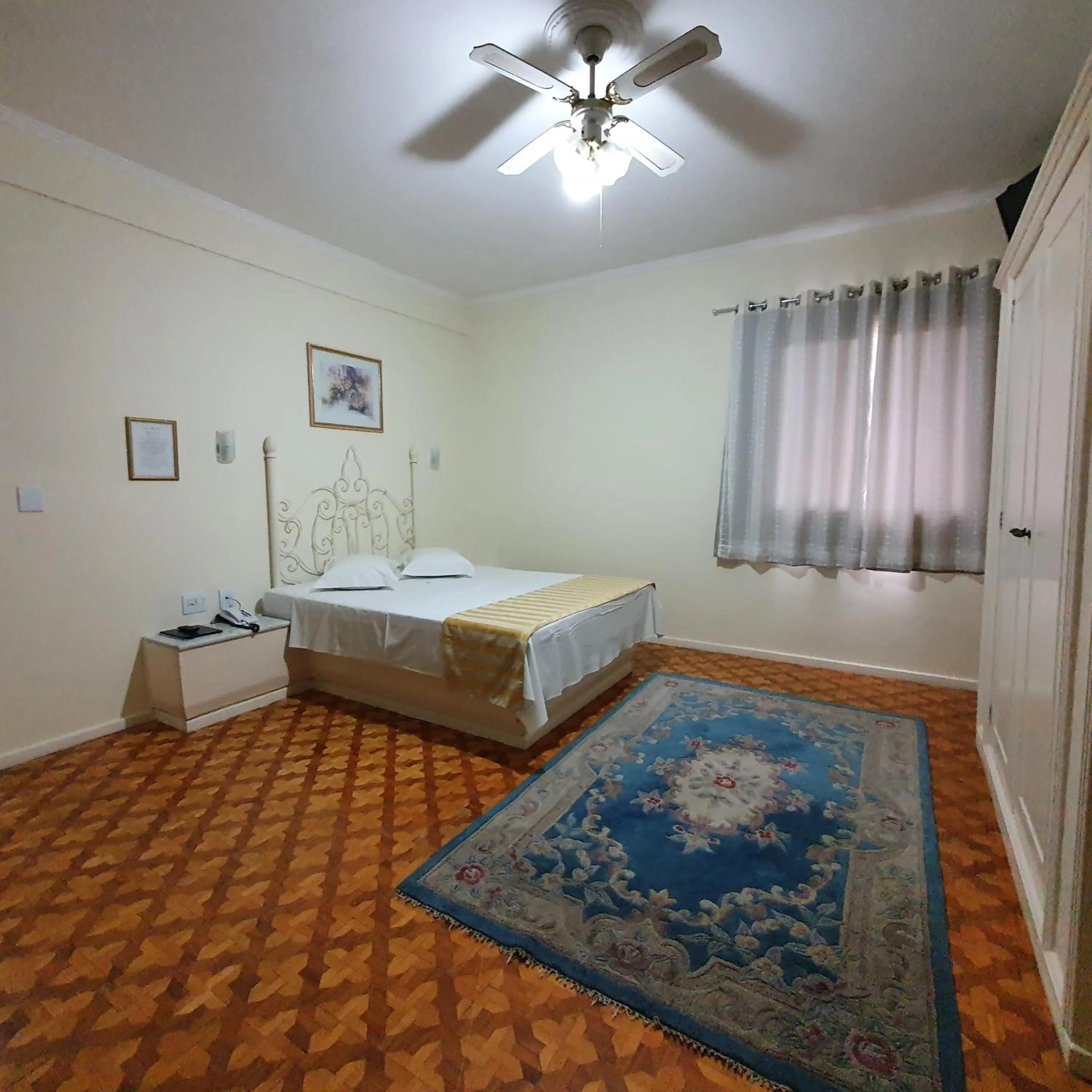 Bed in Grand Ville Hotel