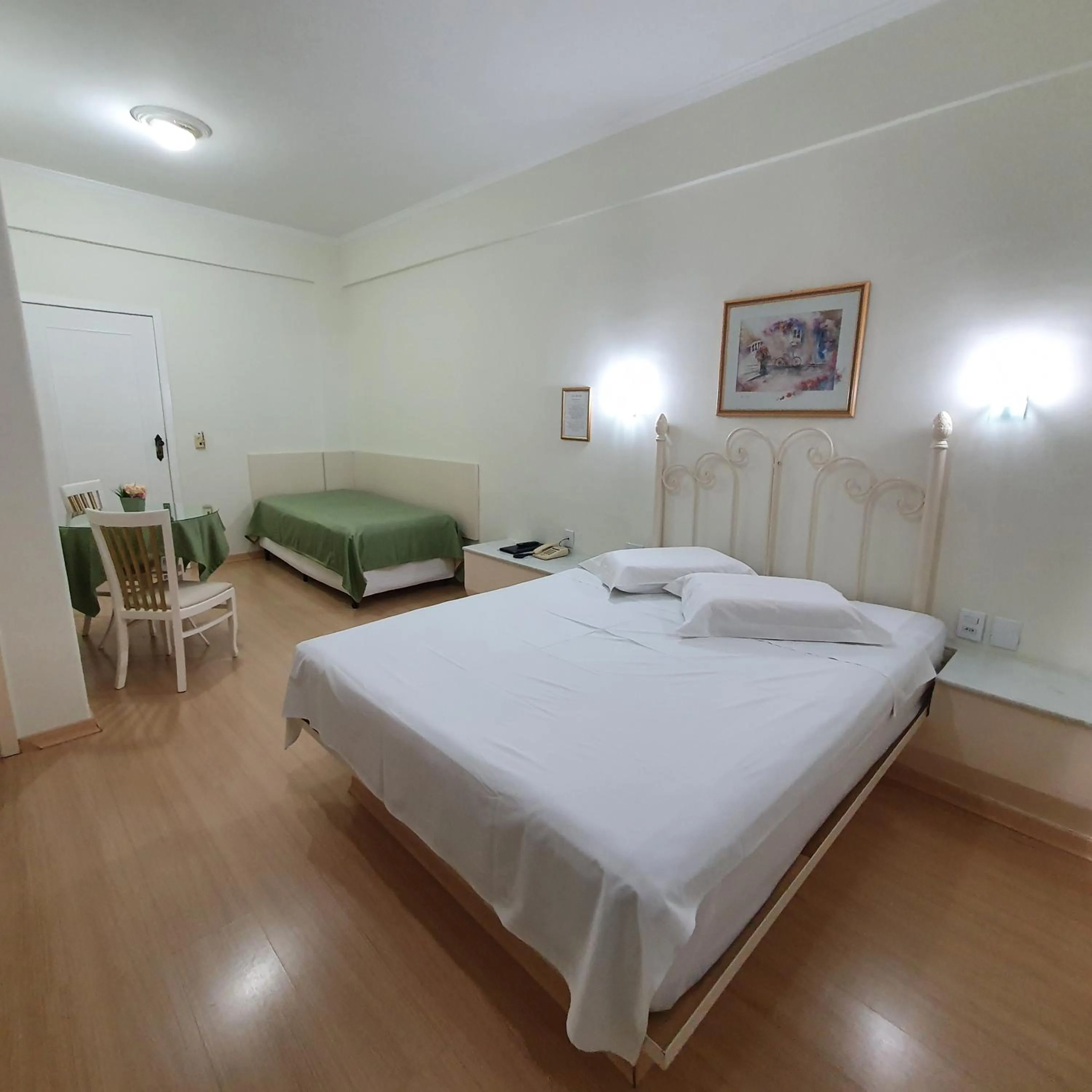 Bed in Grand Ville Hotel