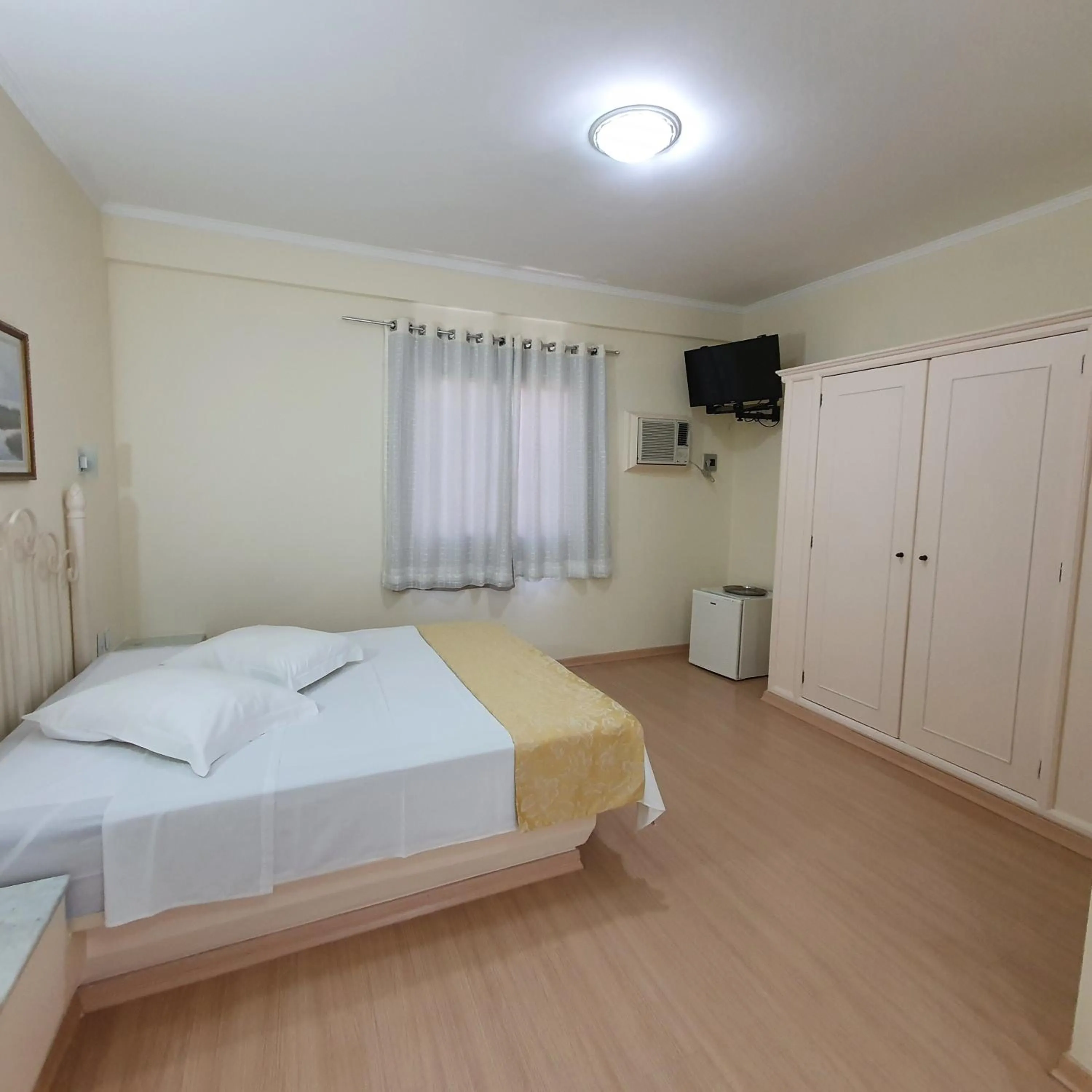 Bed in Grand Ville Hotel