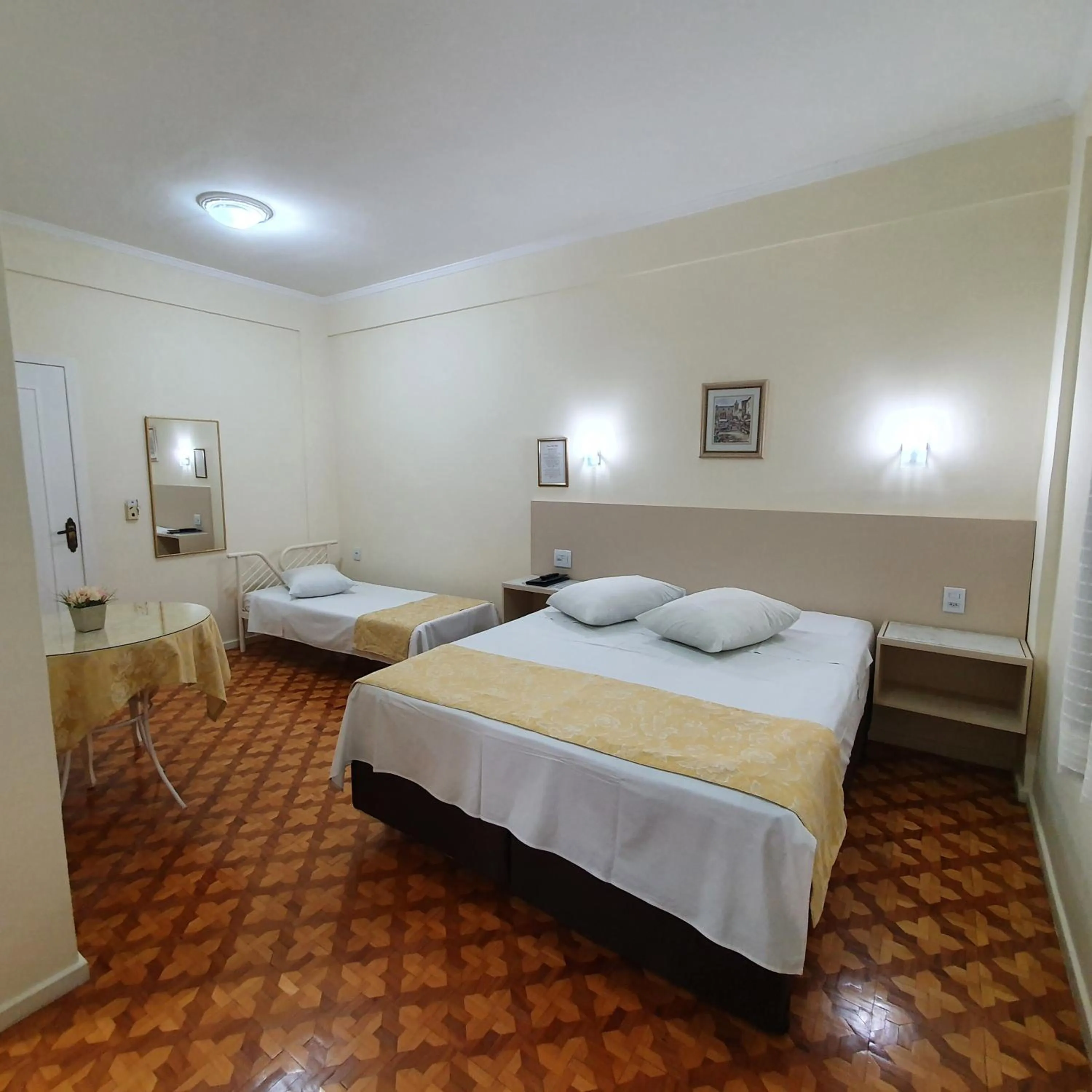 Bed in Grand Ville Hotel