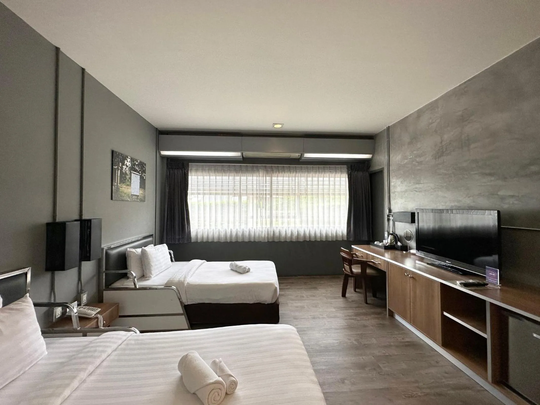 Communal lounge/ TV room, Bed in The Terminal Khon Kaen Hotel