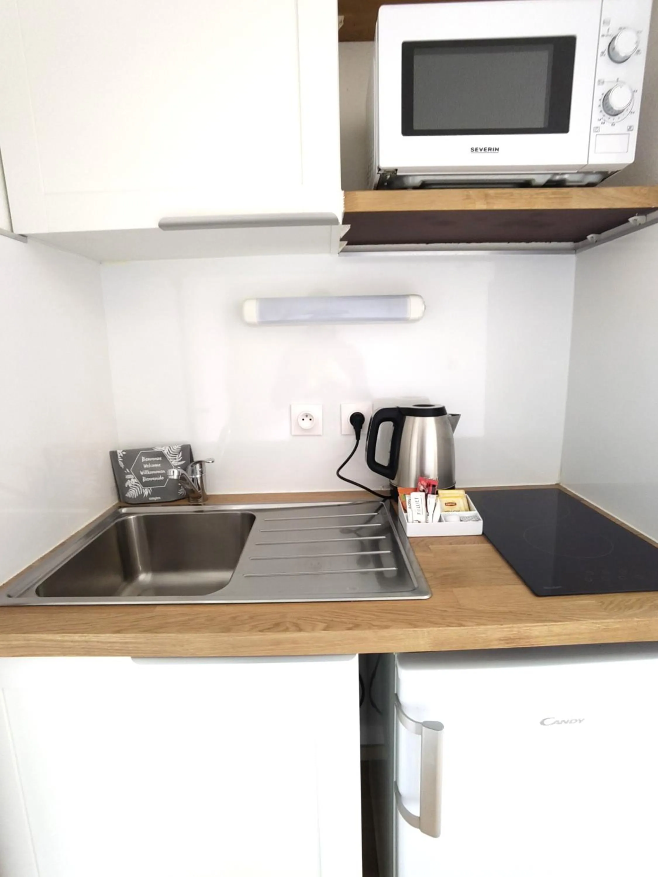 Kitchen or kitchenette in Séjours & Affaires Grenoble Marie Curie