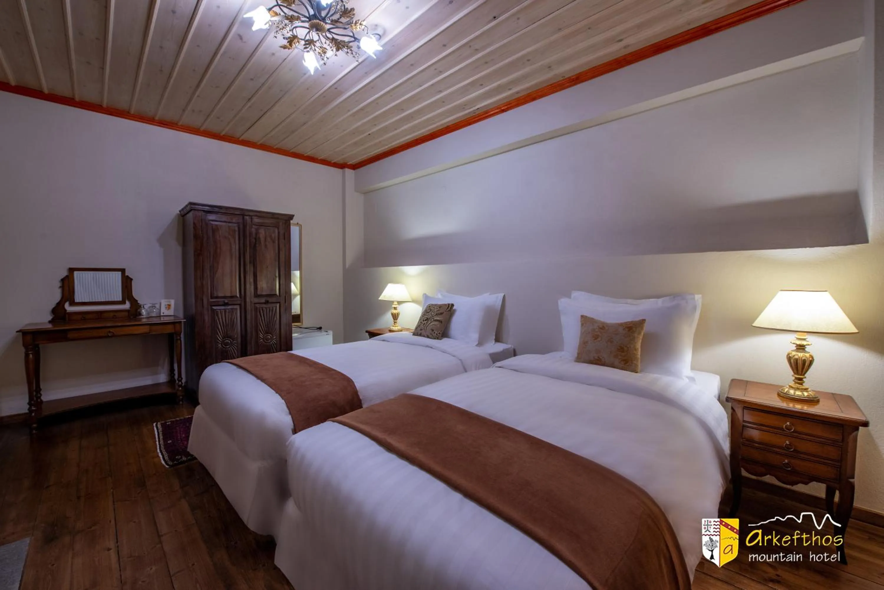 Bed in Arkefthos Mountain Hotel