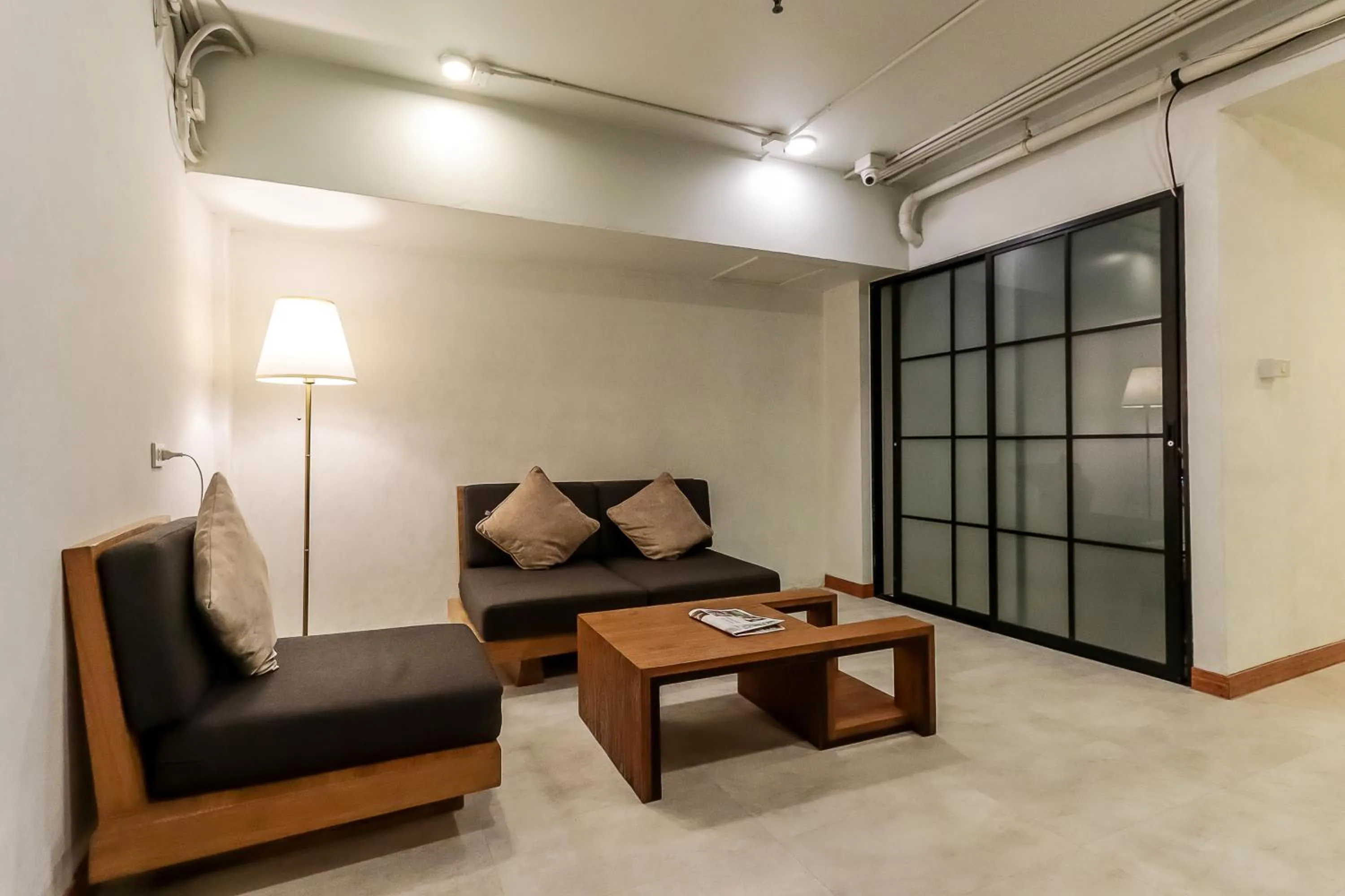 Seating area in StayAt Bedever Bangkok Hotel