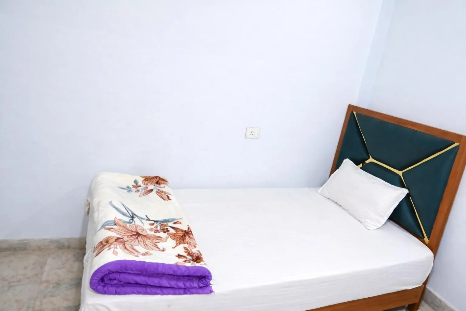 Bed in Mahamaya Guest House