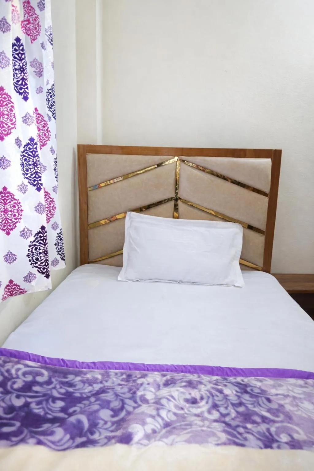 Bed in Mahamaya Guest House