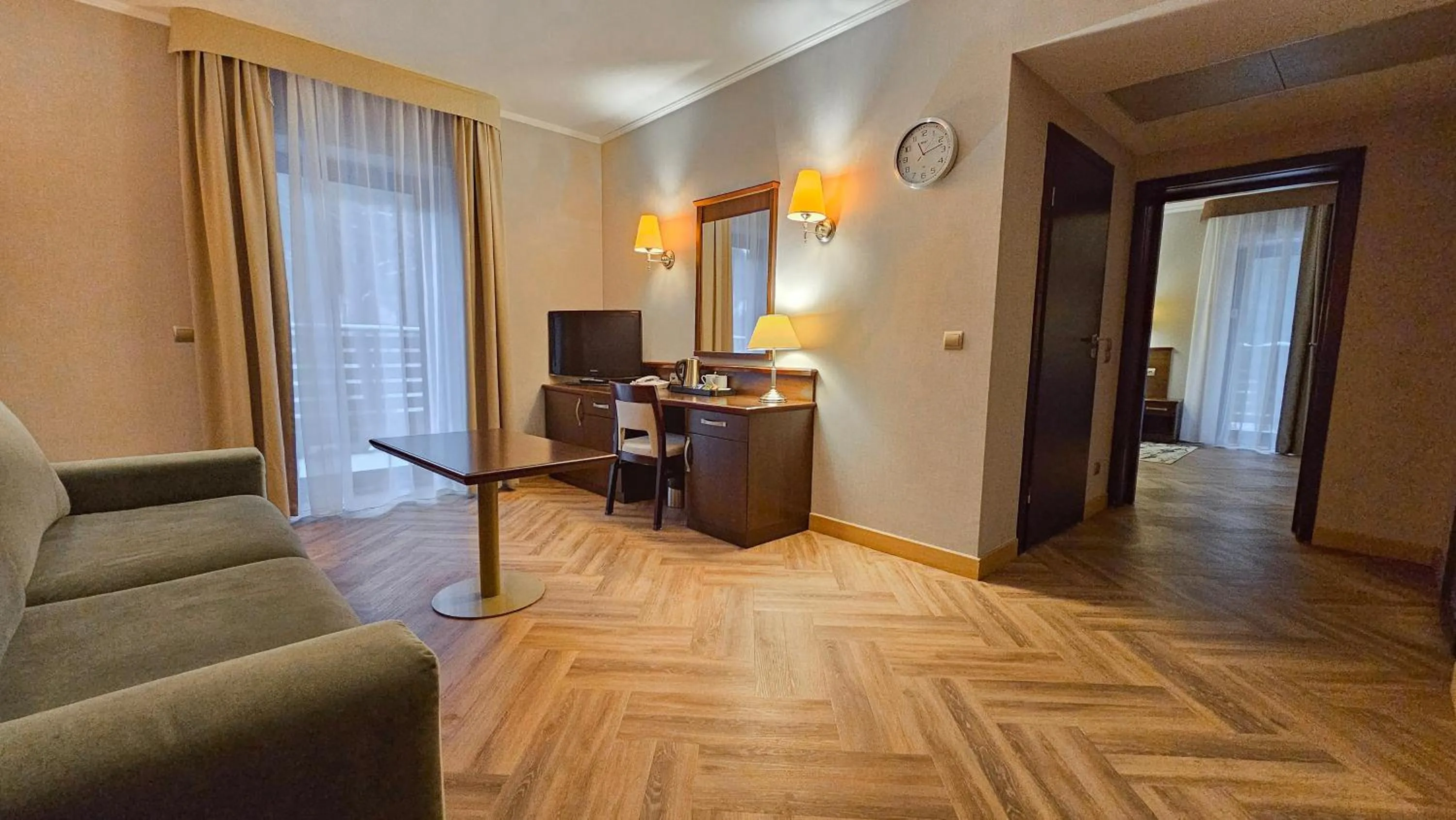 Communal lounge/ TV room in Malinowy Dwór Hotel Medical SPA