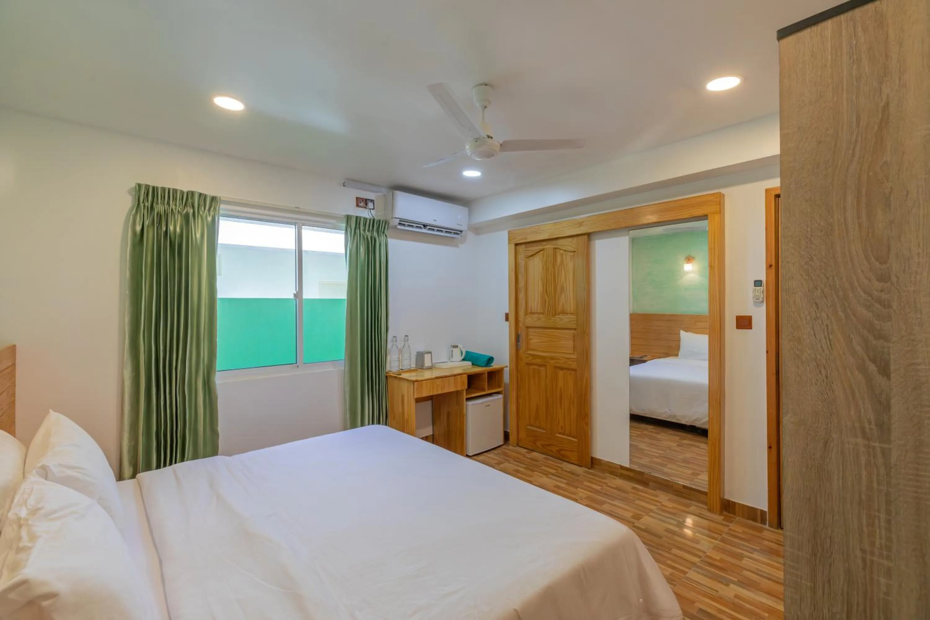 Photo of the whole room, Bed in Turtle Maldives - Your Gateway to the Beach & Marine Adventures Await!