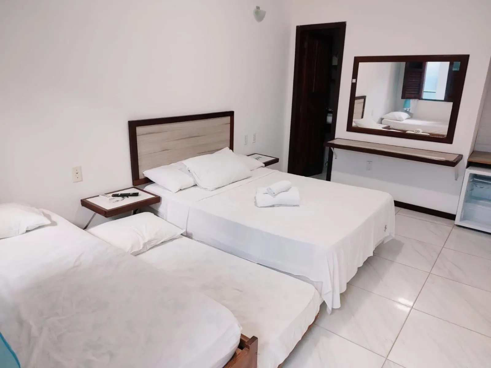 Bed in Pousada Camburi Star