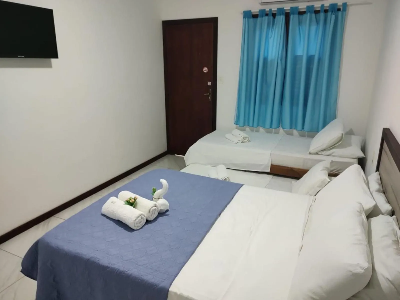 Bed in Pousada Camburi Star
