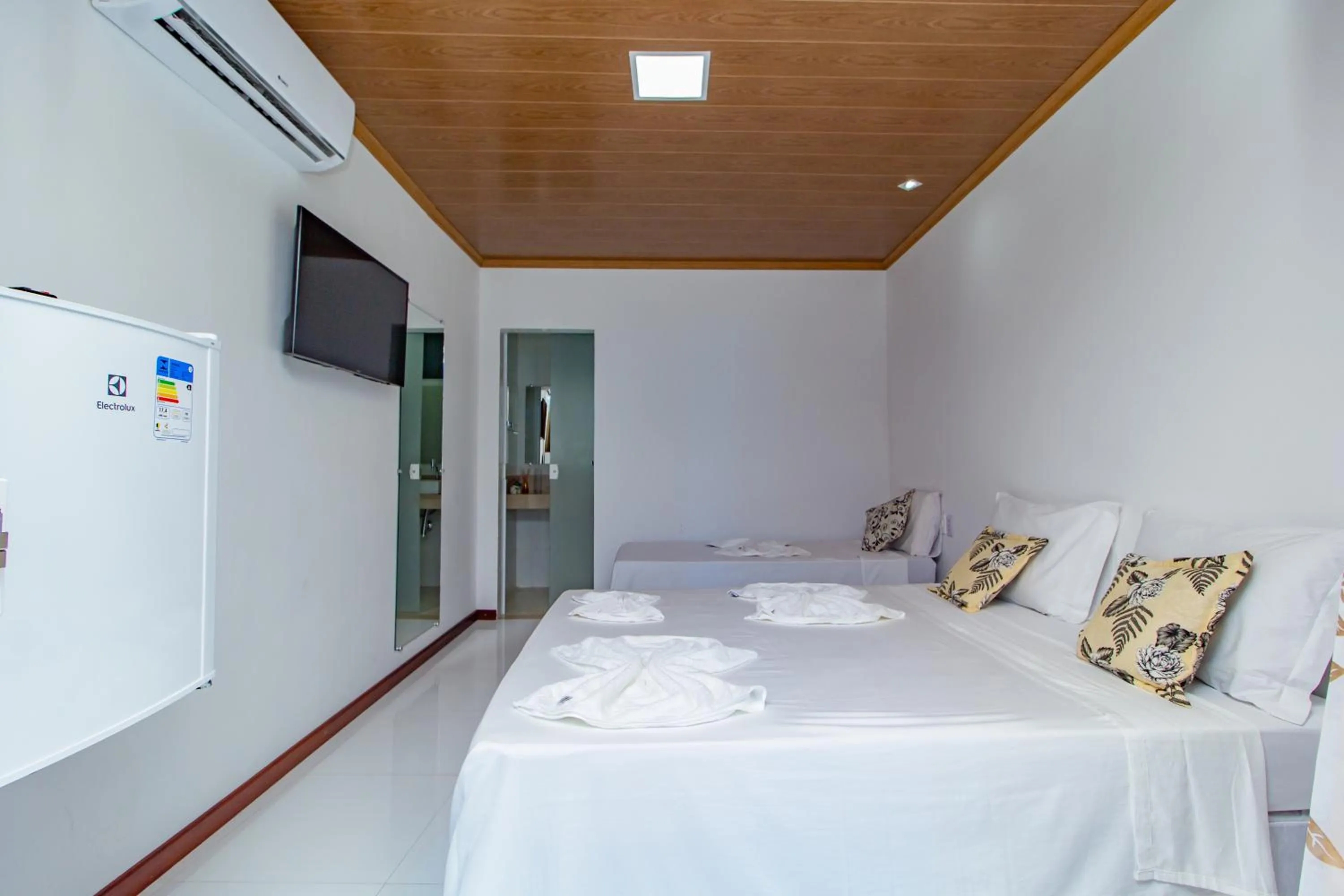 Bed in Pousada Camburi Star