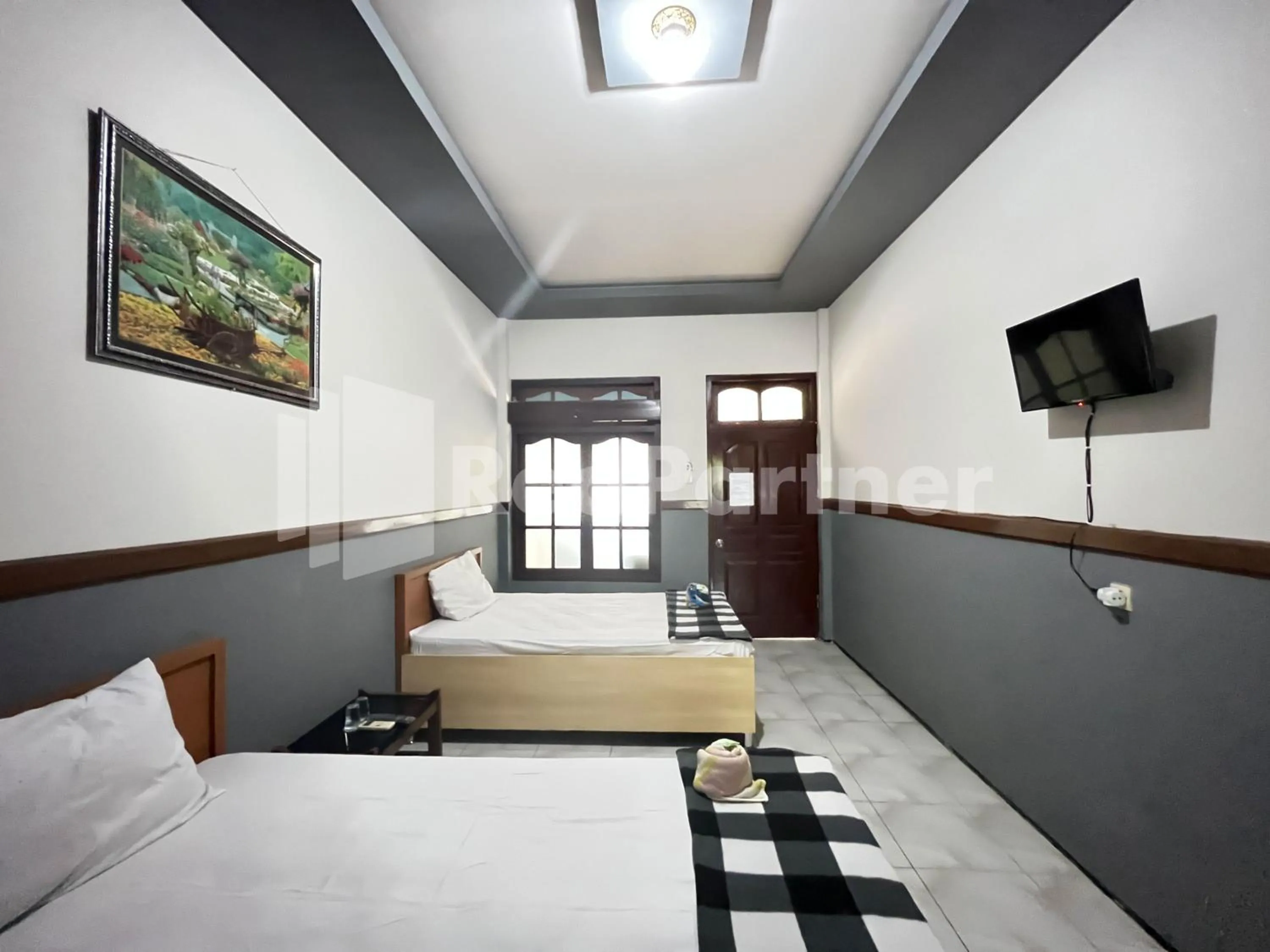 Bedroom, Bed in Hotel Dewi near GOR Merdeka Jombang Mitra RedDoorz