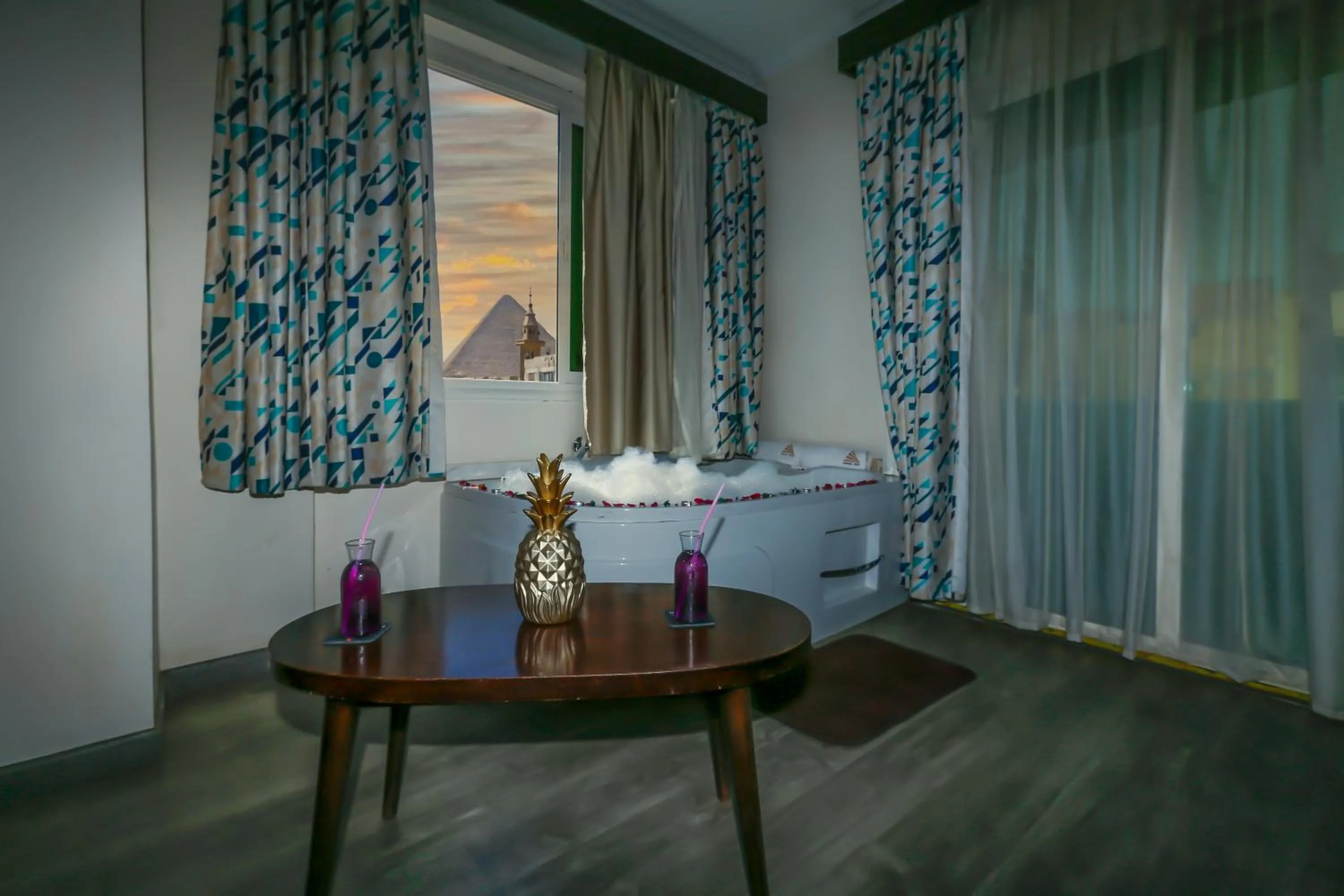 Living room, Bed in Pyramid Edge Hotel & Exclusive Pyramids View Rooftop