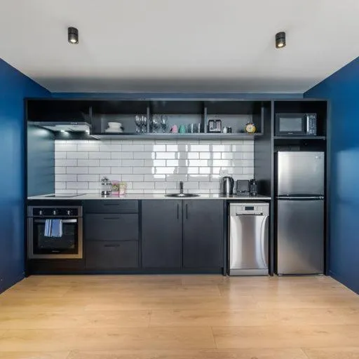 kitchen in Roomie Apartment Hotel