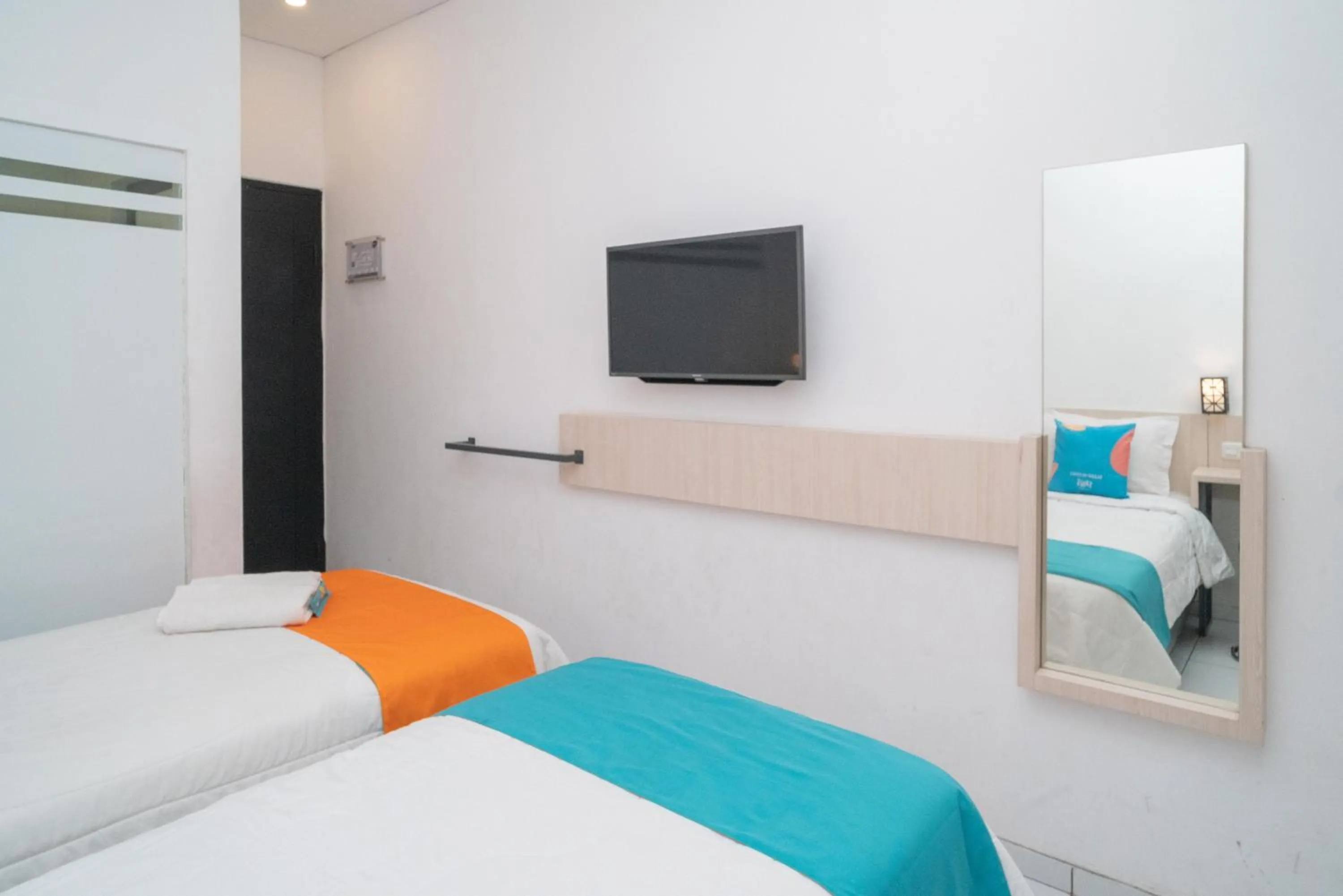 Bedroom, Bed in Sans Hotel FiFFa Premiere Malang