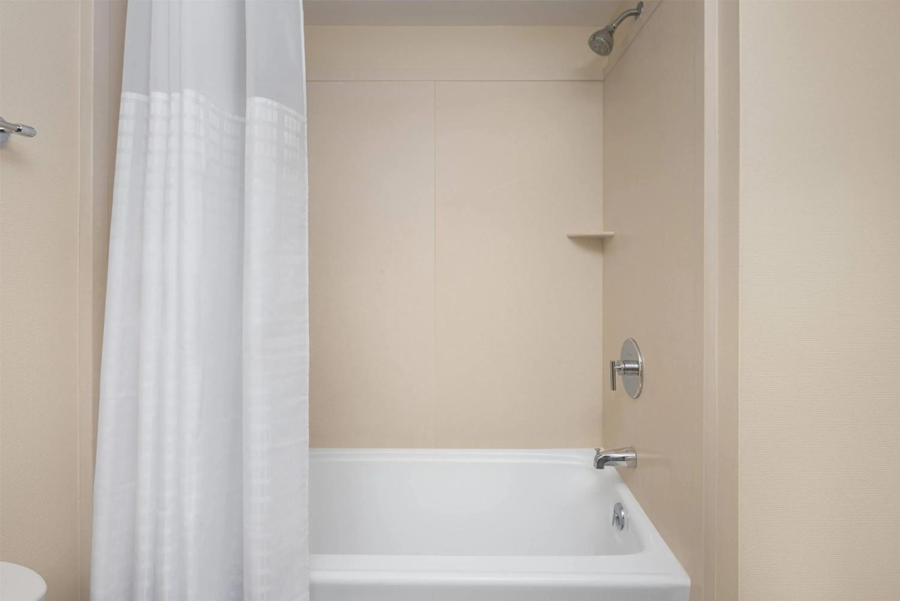 Bathroom in Ramada Plaza by Wyndham Orlando Resort & Suites Intl Drive - Newly Renovated!