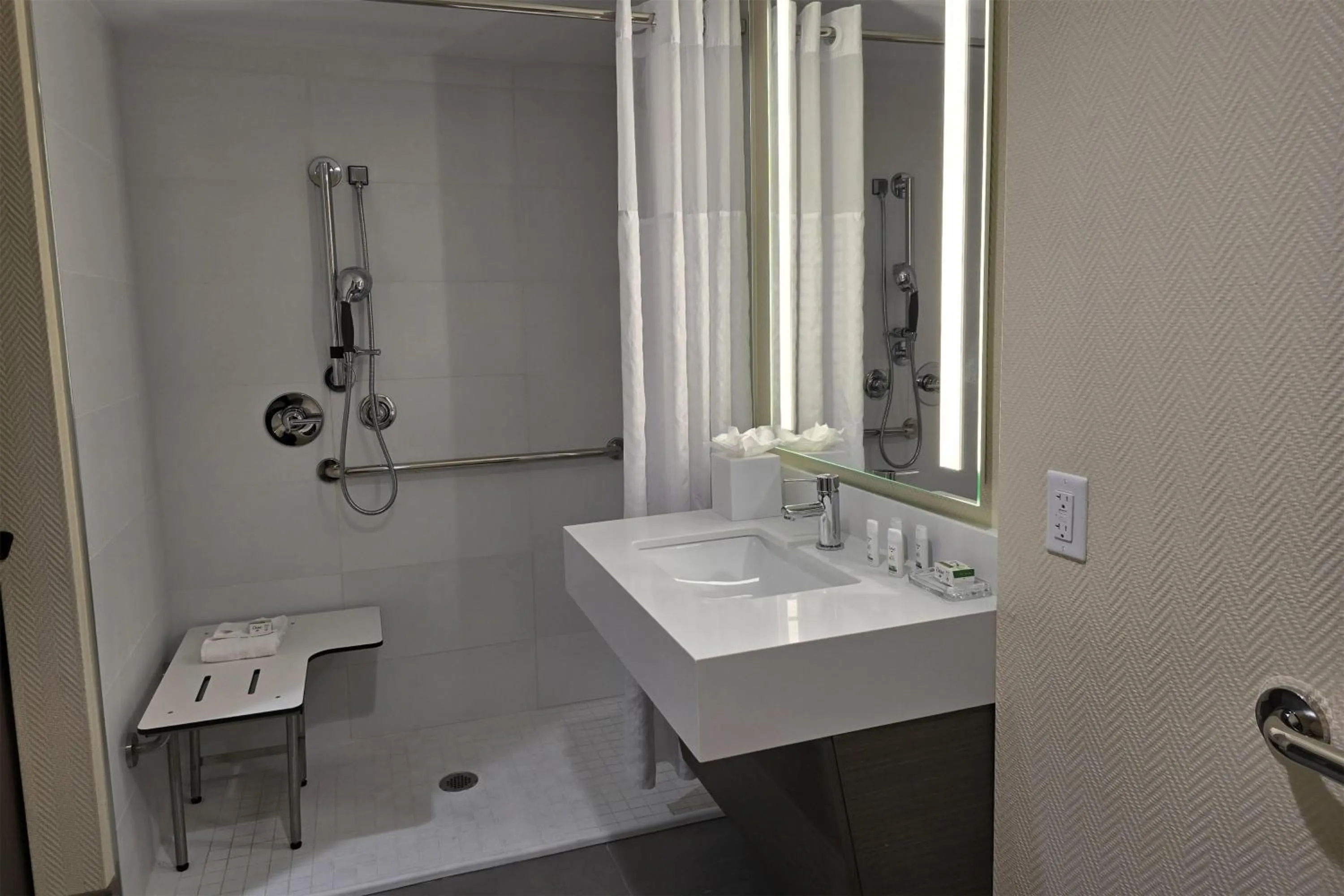 Bathroom in Ramada Plaza by Wyndham Orlando Resort & Suites Intl Drive - Newly Renovated!