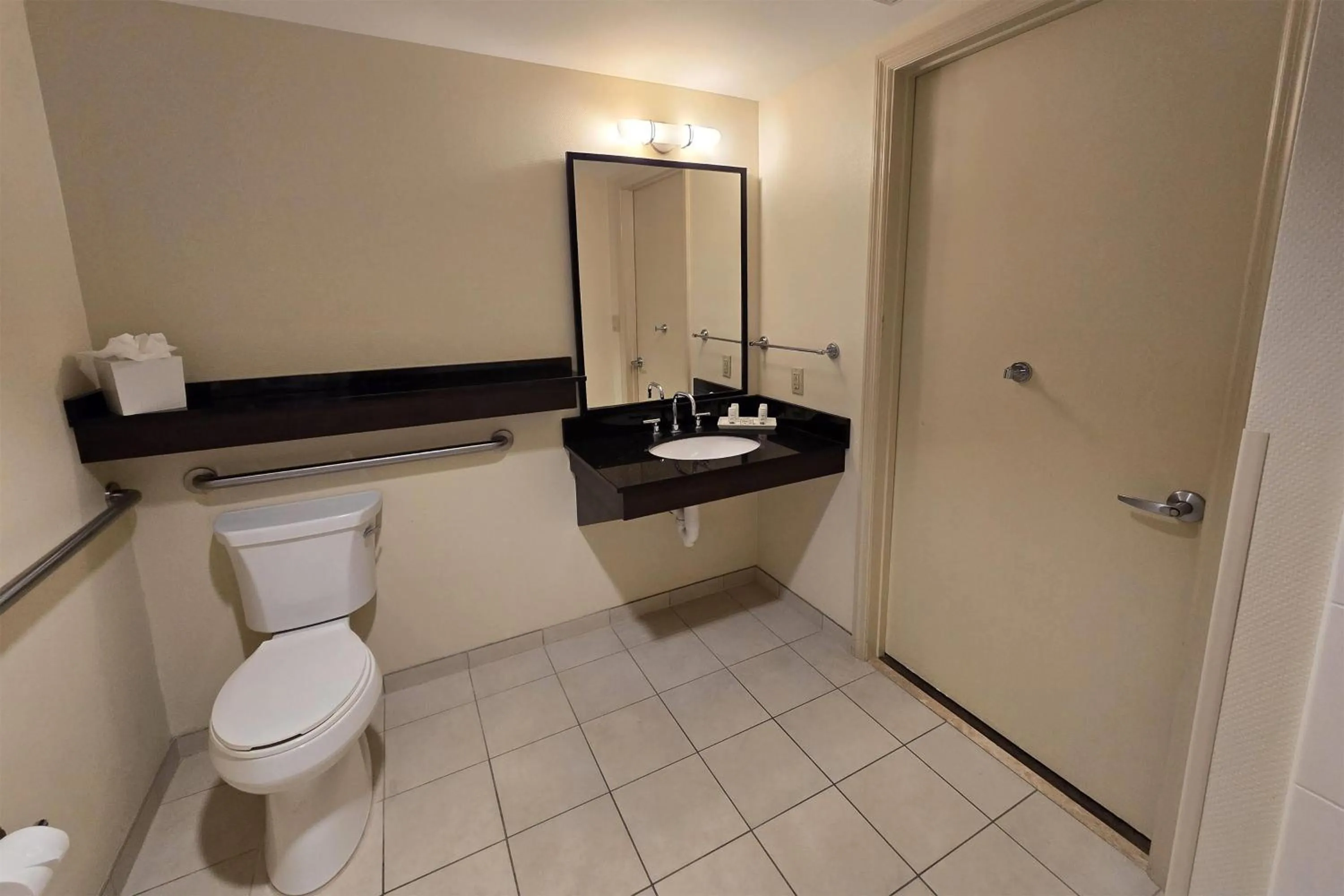 Bathroom in Ramada Plaza by Wyndham Orlando Resort & Suites Intl Drive - Newly Renovated!