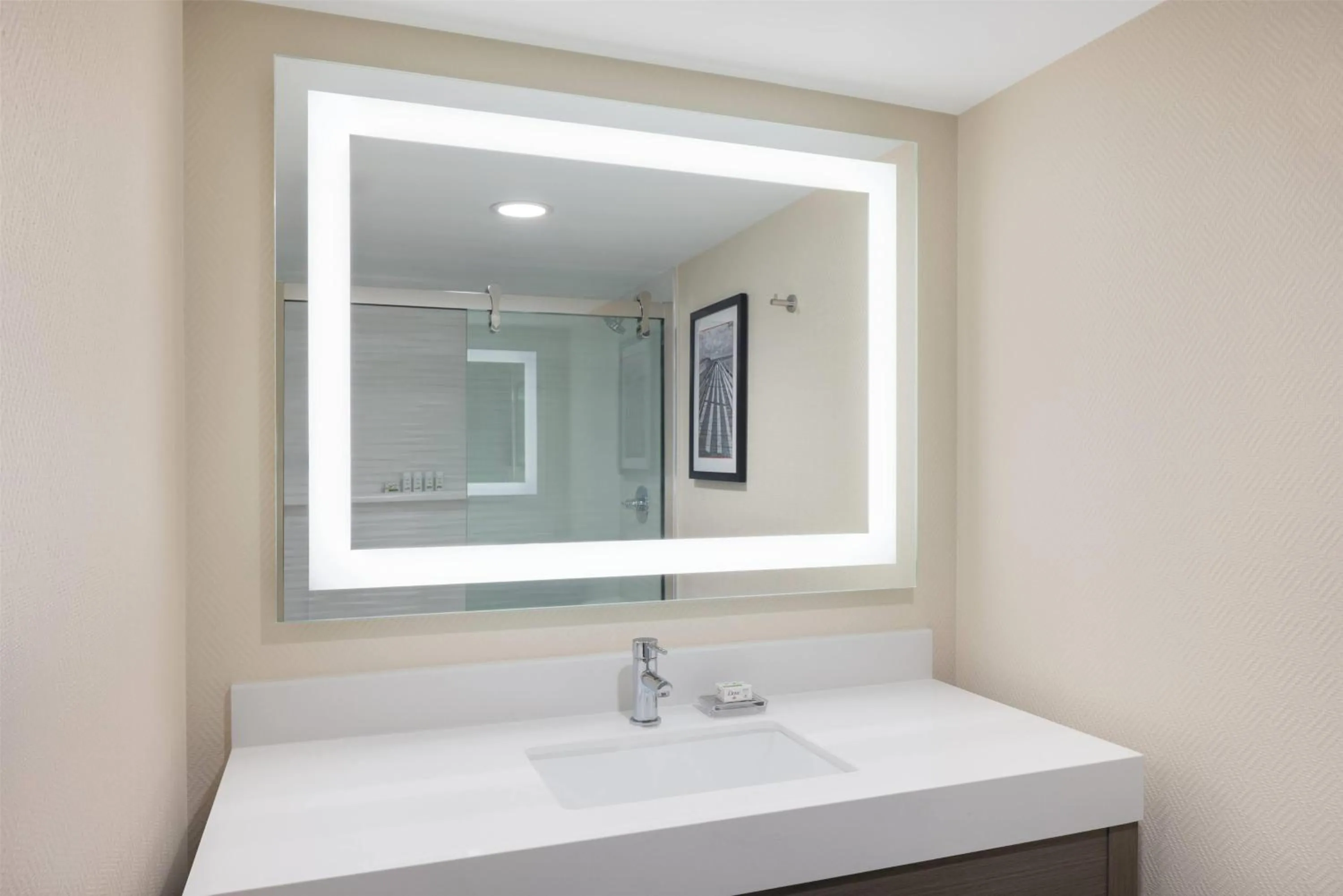 Bathroom in Ramada Plaza by Wyndham Orlando Resort & Suites Intl Drive - Newly Renovated!