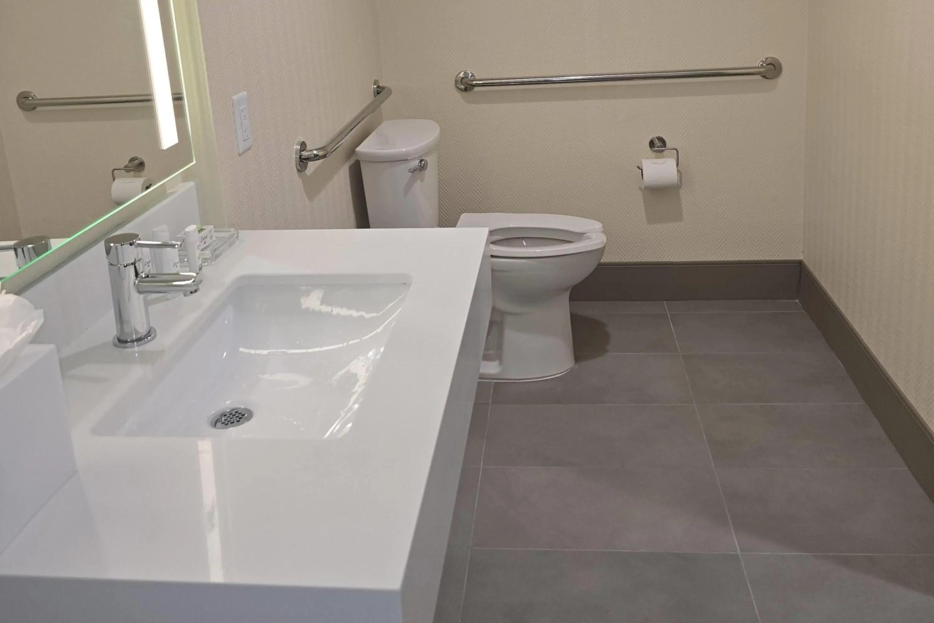 Bathroom in Ramada Plaza by Wyndham Orlando Resort & Suites Intl Drive - Newly Renovated!