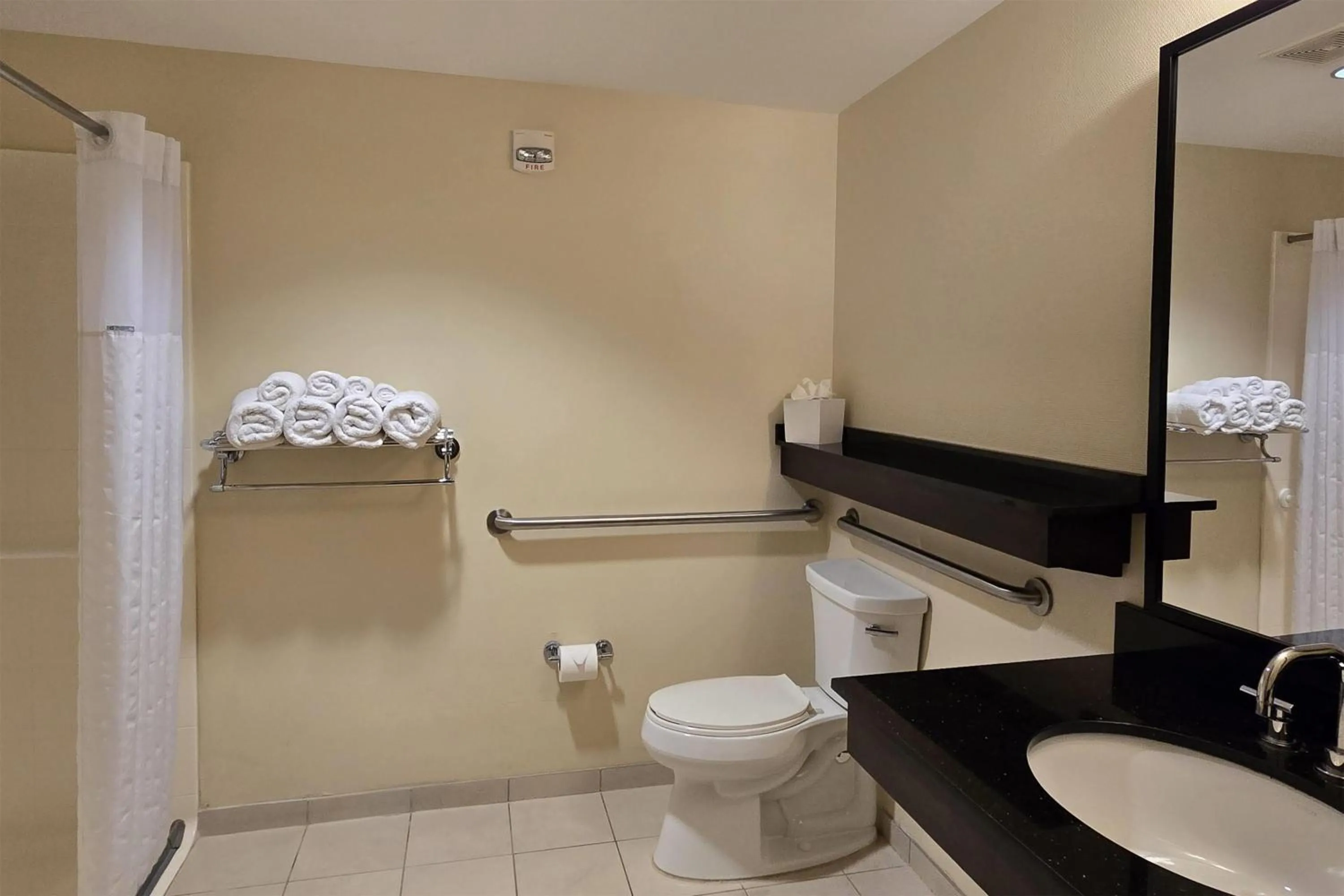 Bathroom in Ramada Plaza by Wyndham Orlando Resort & Suites Intl Drive - Newly Renovated!