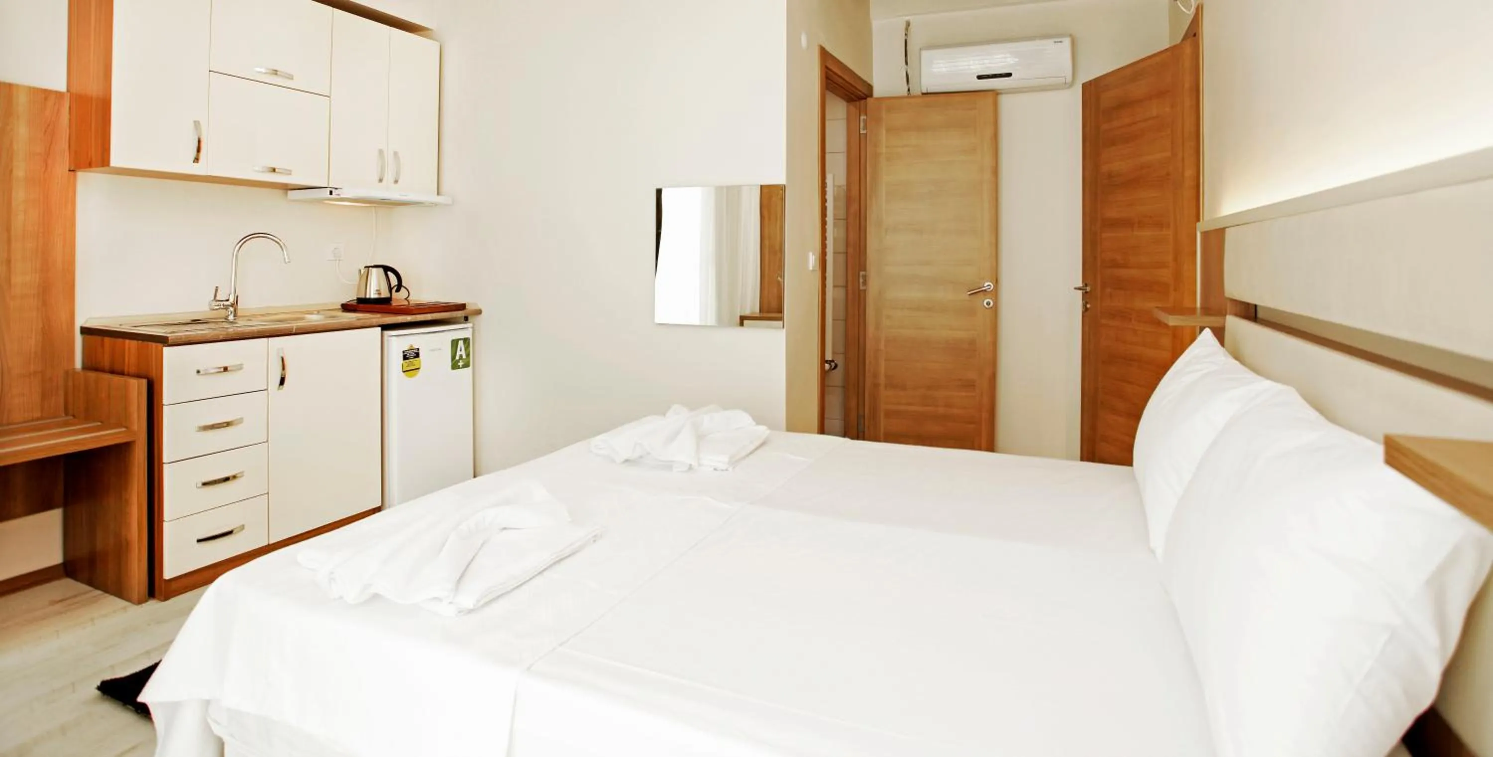 Bed in Kavalalı Suites