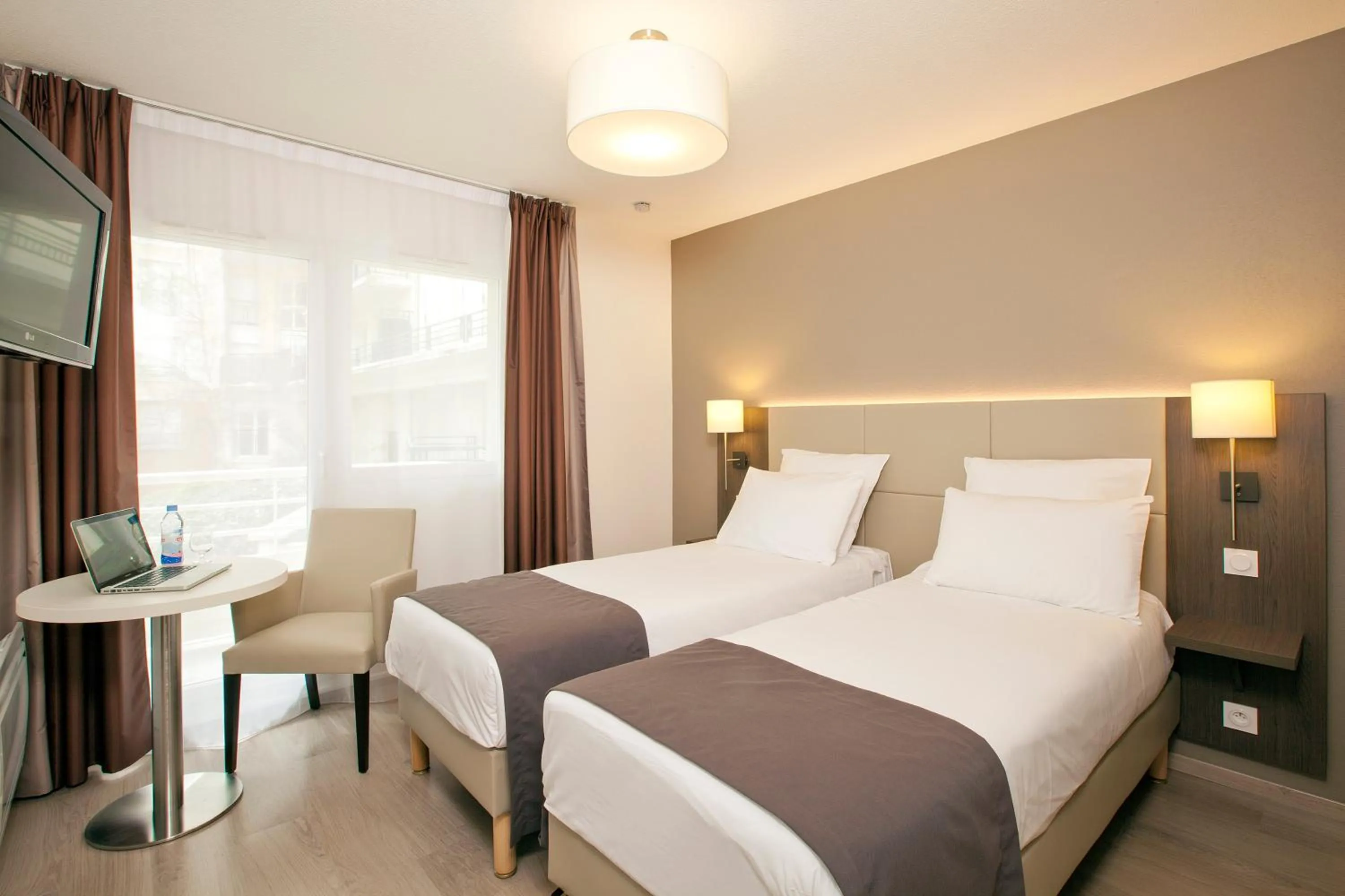 Bedroom, Bed in Séjours & Affaires Courbevoie Grande Arche