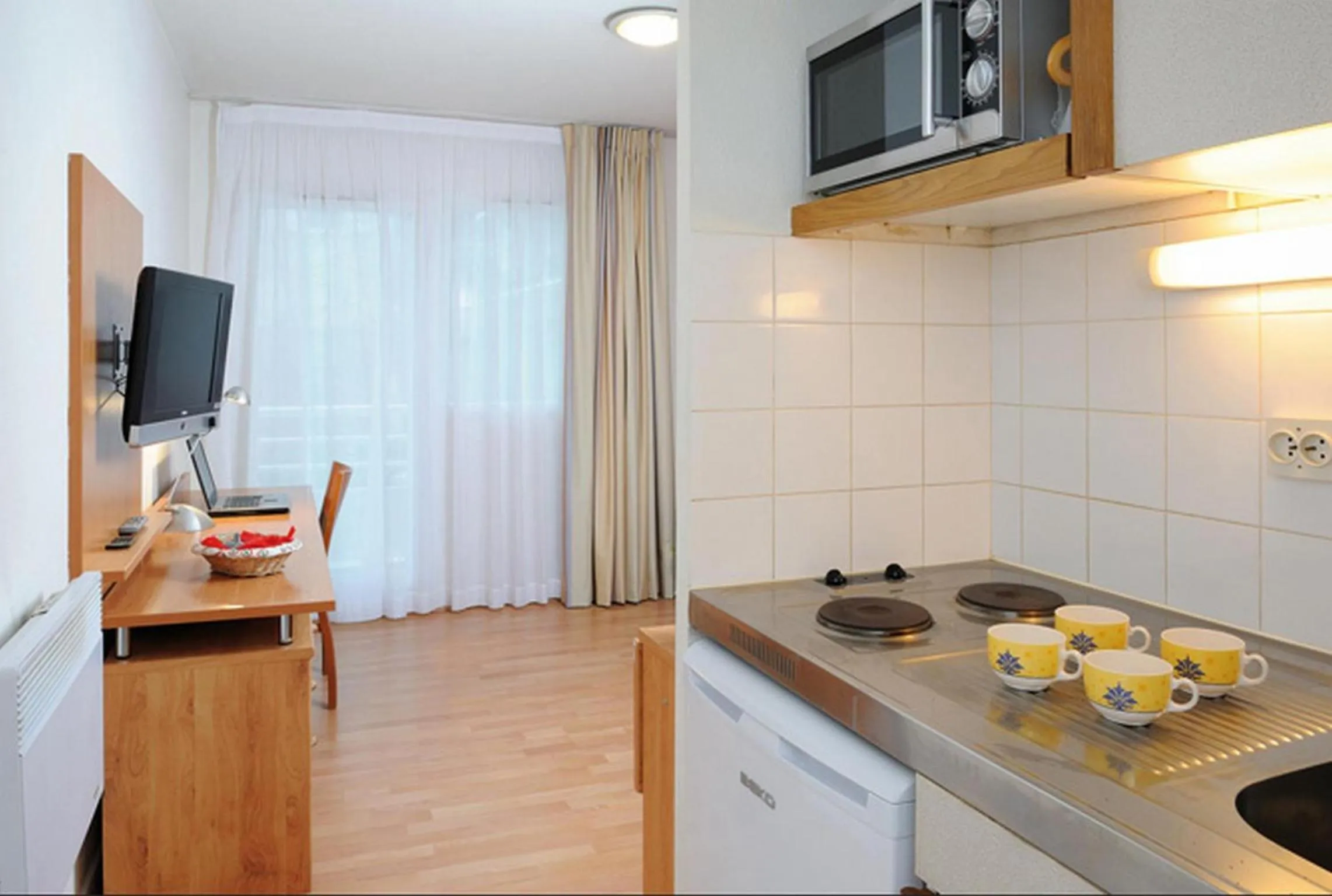 Kitchen or kitchenette in Séjours & Affaires Courbevoie Grande Arche