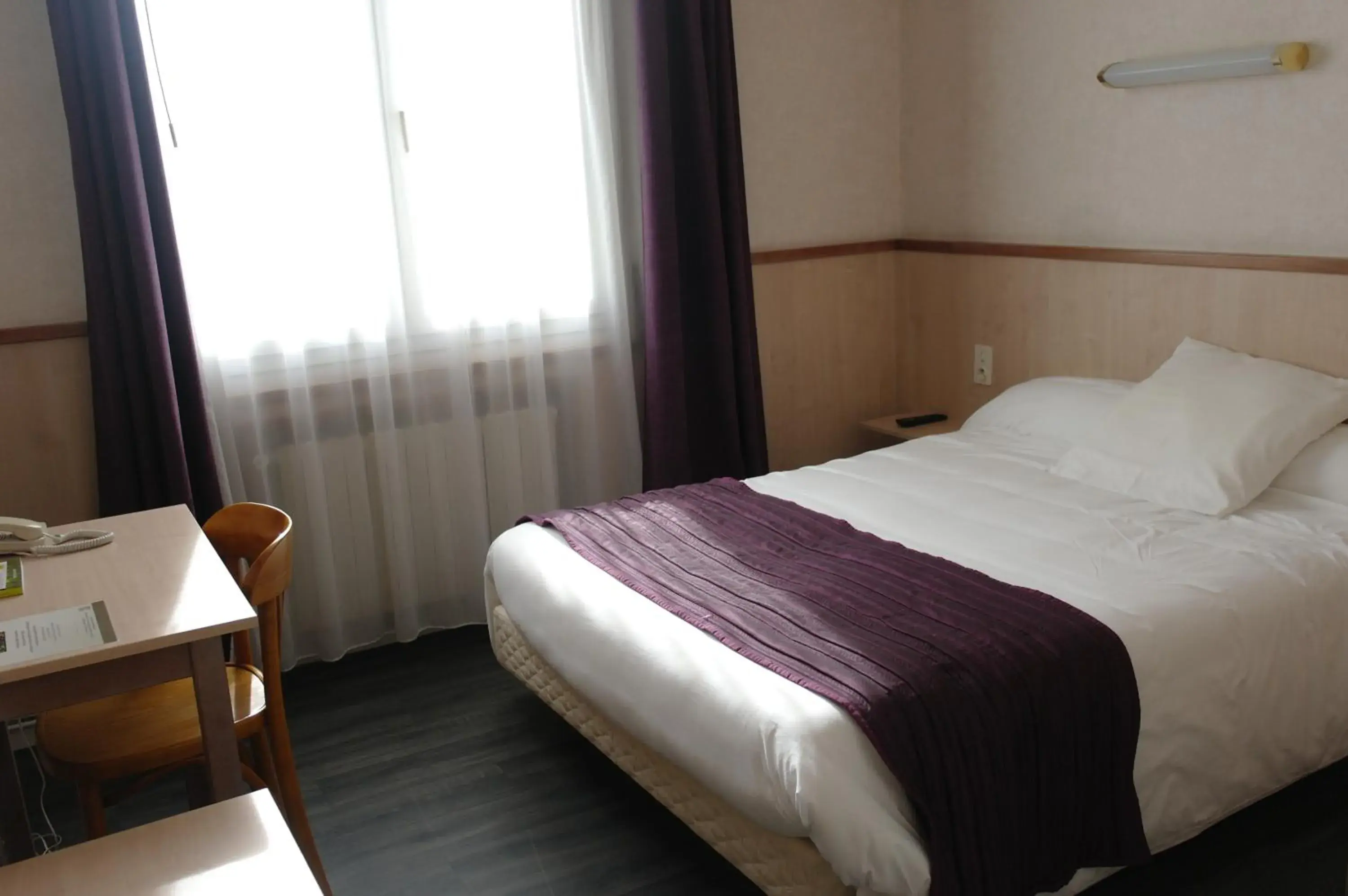 Bed in Hôtel Le Palous Bed in Hôtel Le Palous