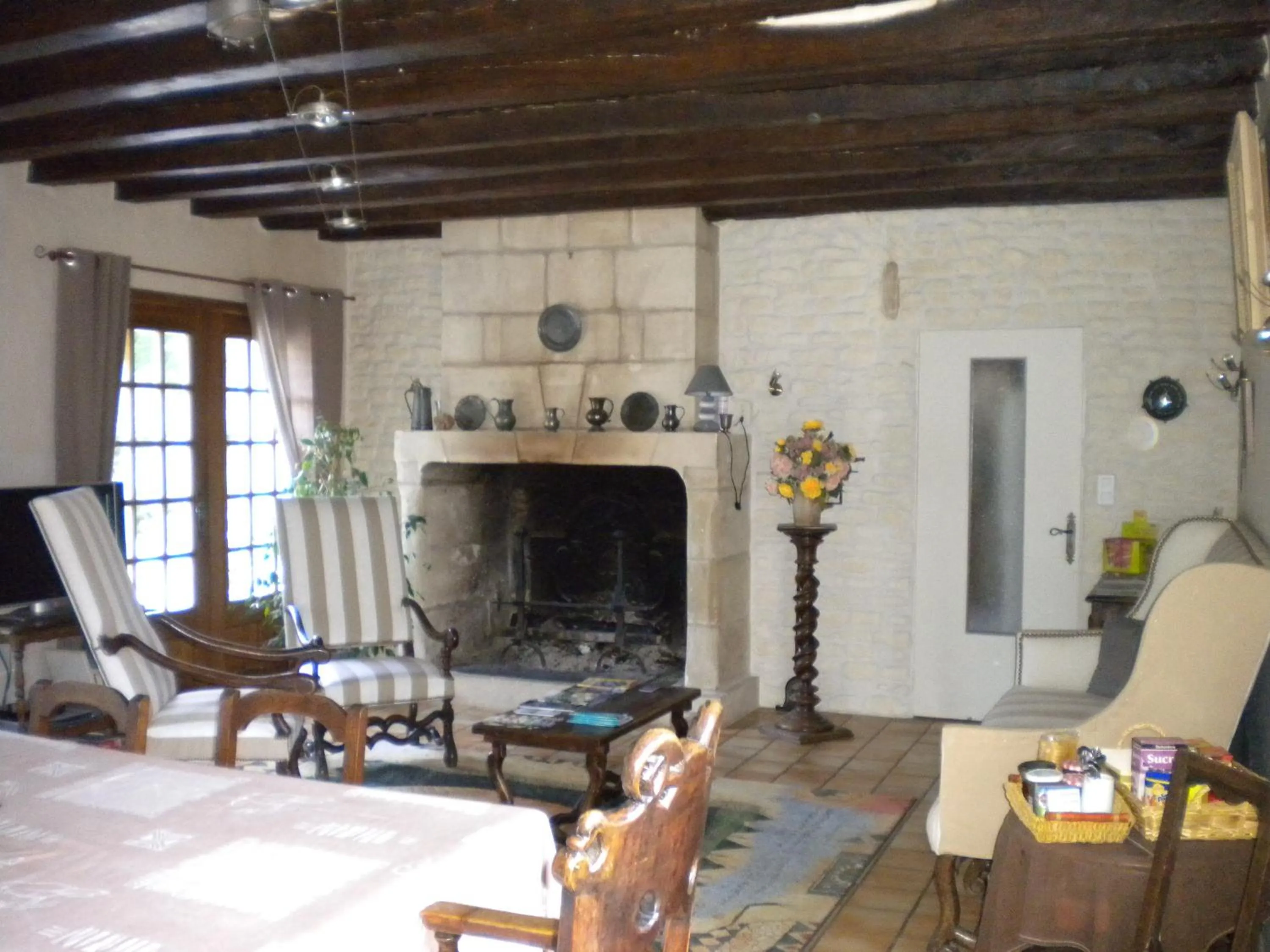 Communal lounge/ TV room in Le Moulin Garnier