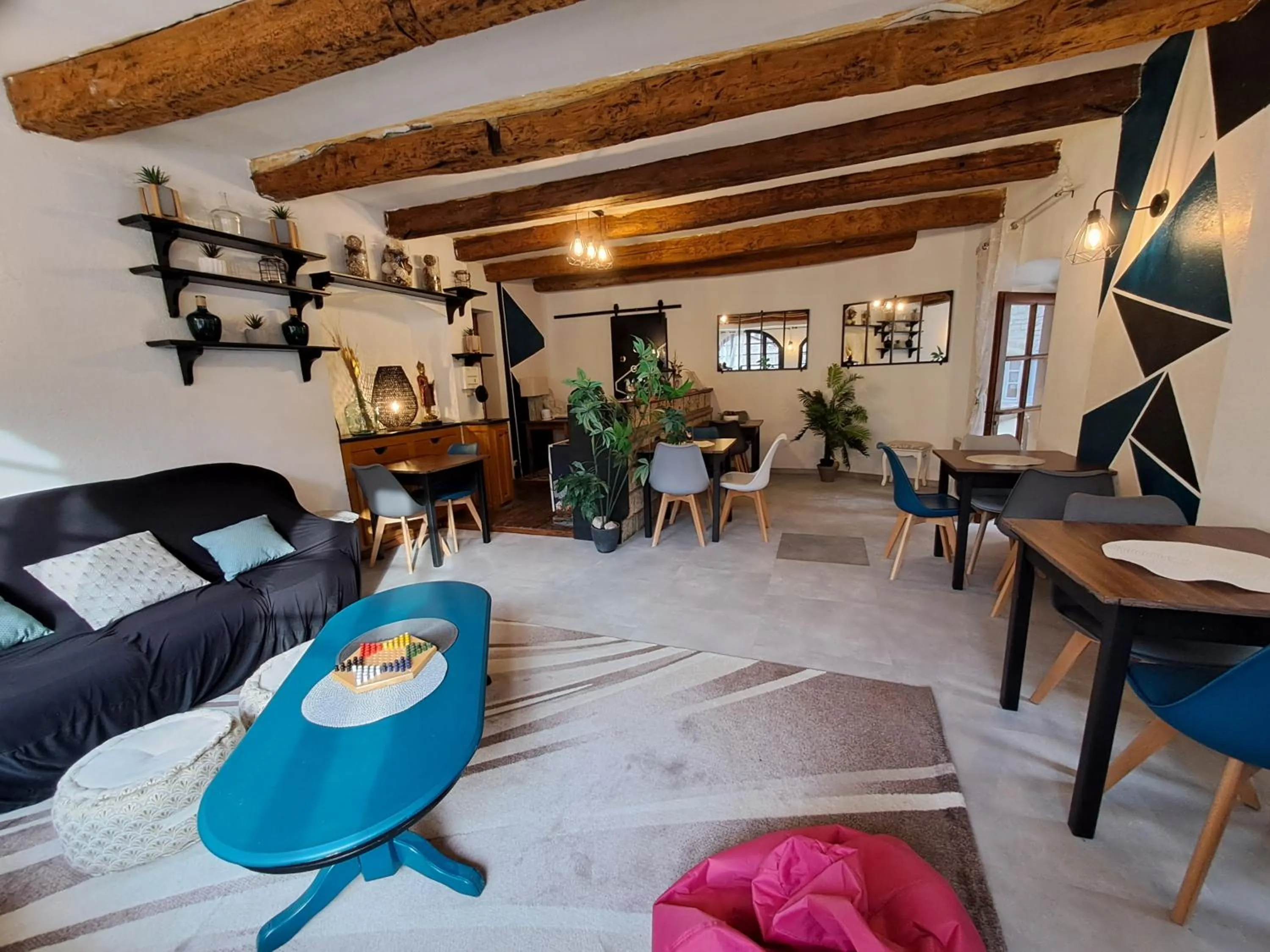 Communal lounge/ TV room in Logis Hôtel restaurant Auberge de la Cascade