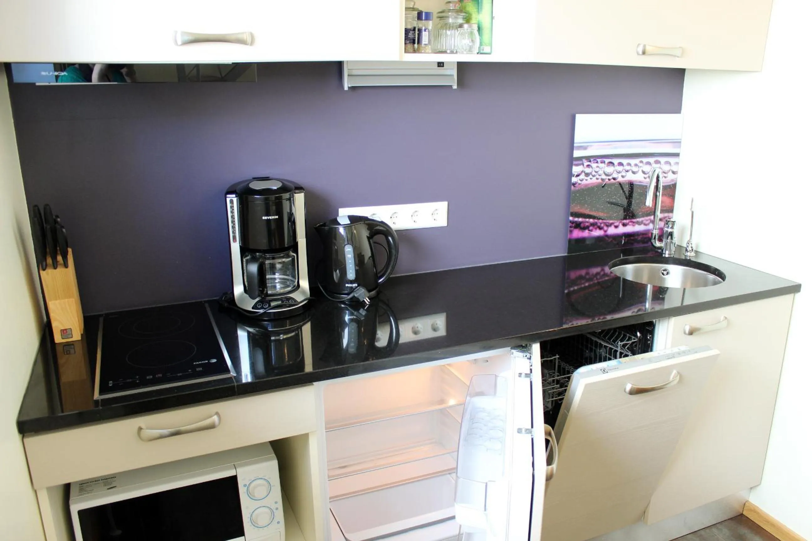 Kitchen or kitchenette in Embrace Hotel & Apartments