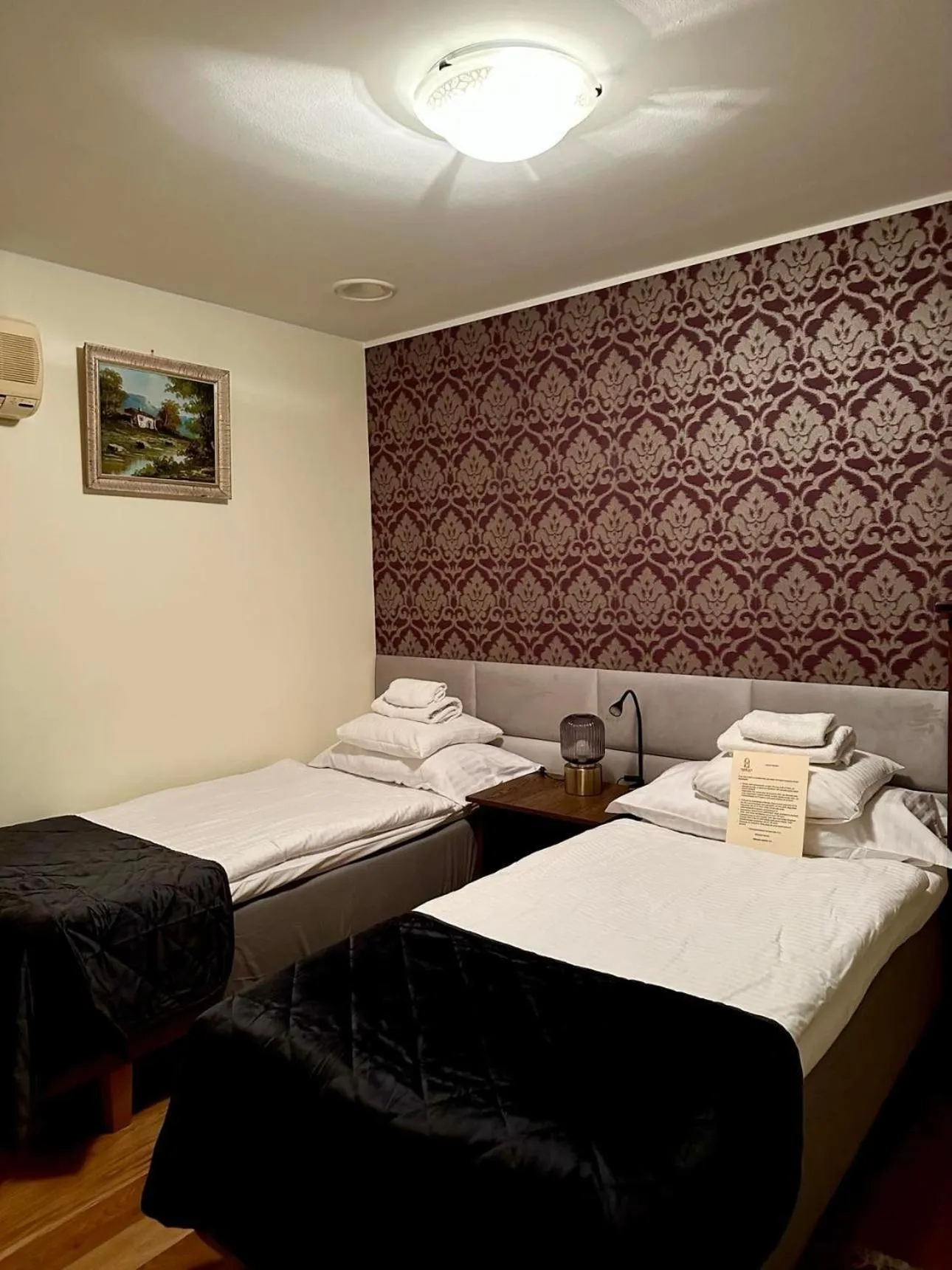 Bed in Embrace Hotel & Apartments