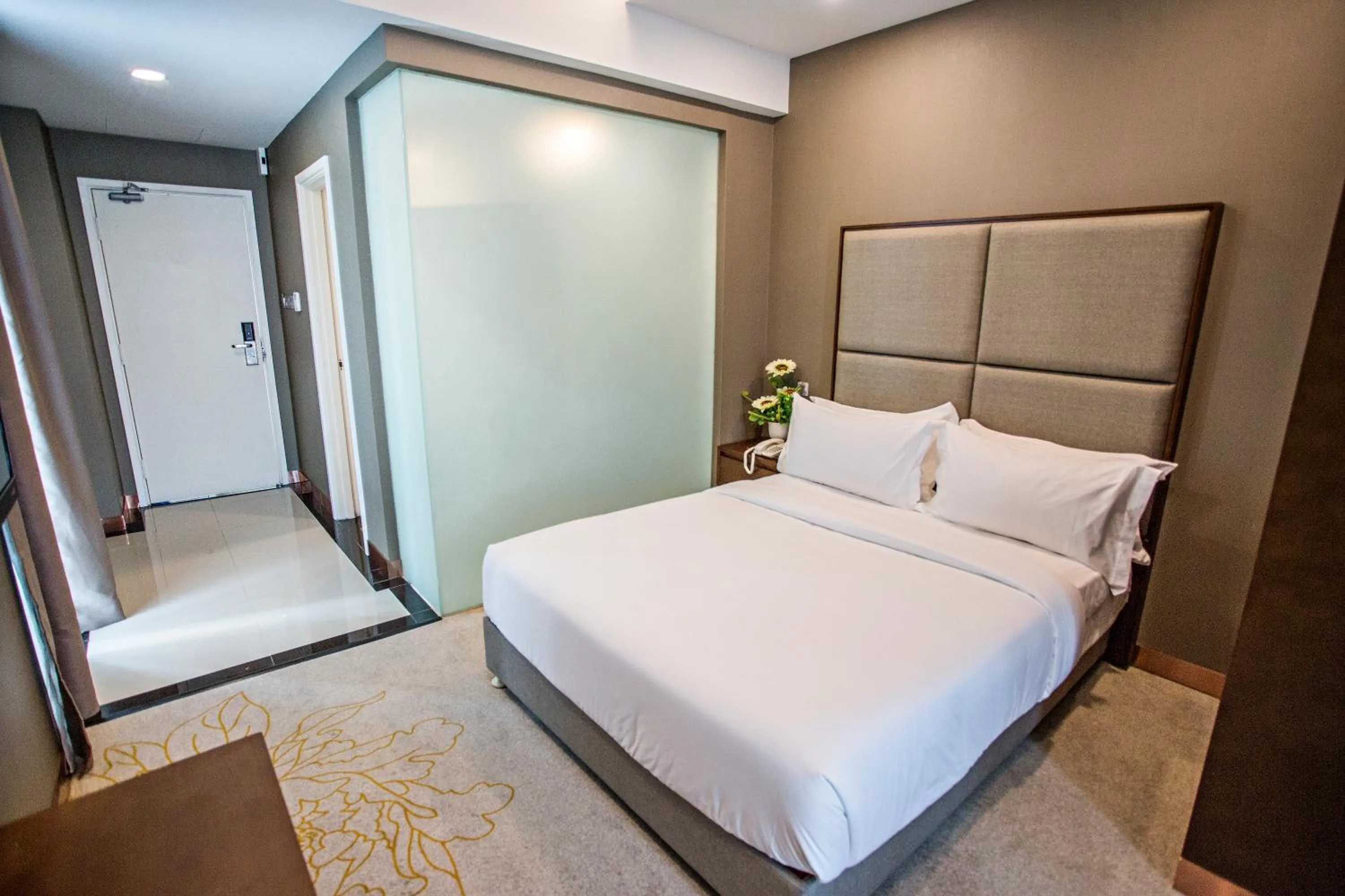 Bed in GRAND FLORA HOTEL