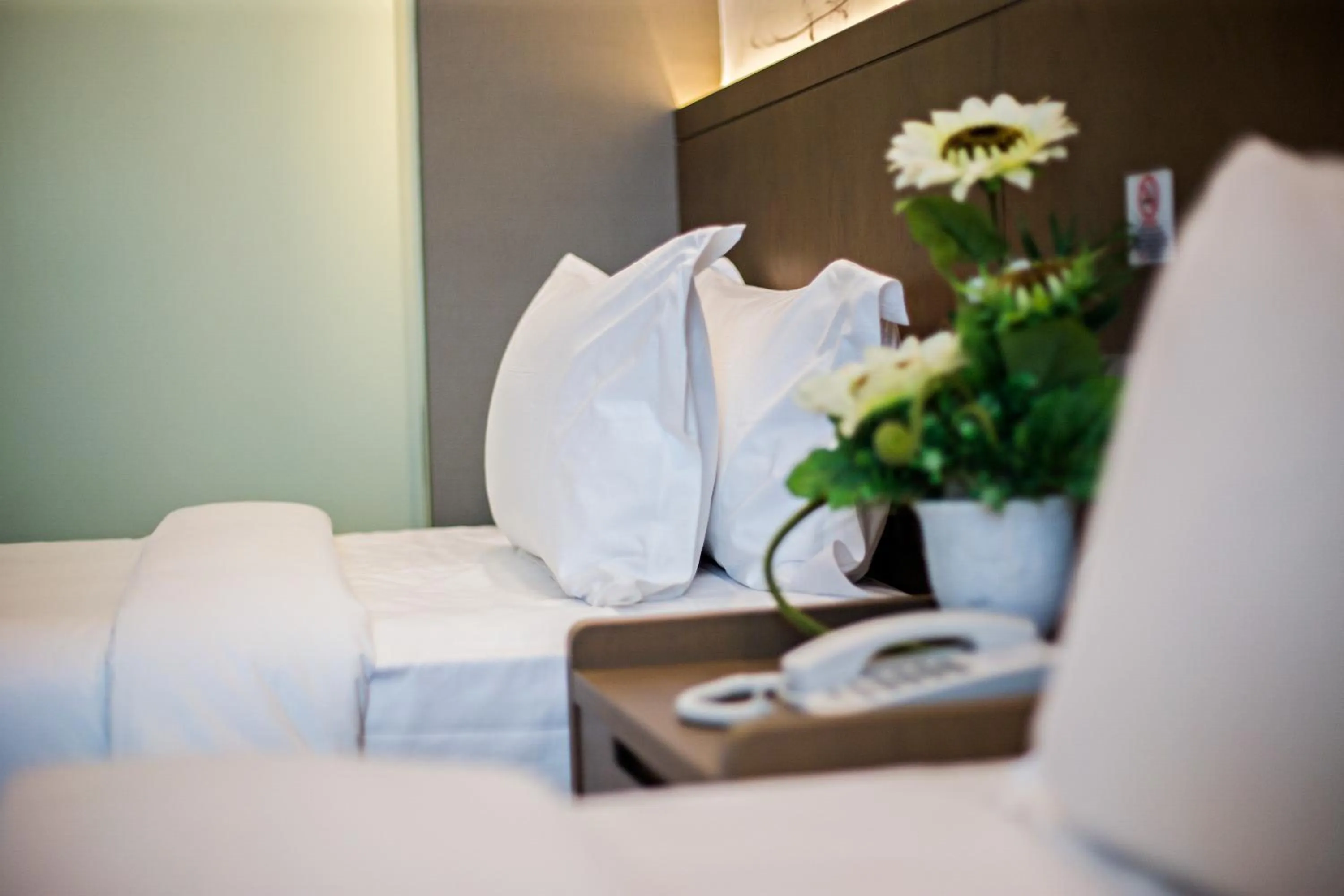 Bed in GRAND FLORA HOTEL